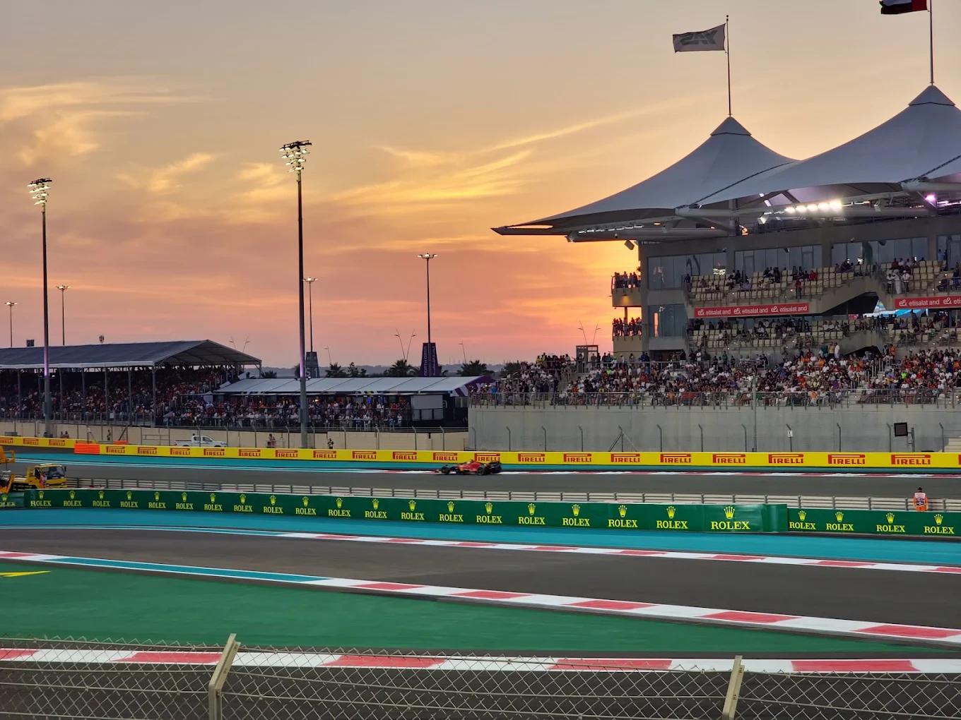The grandstand and start straight of Yas Marina Circuit at sunset