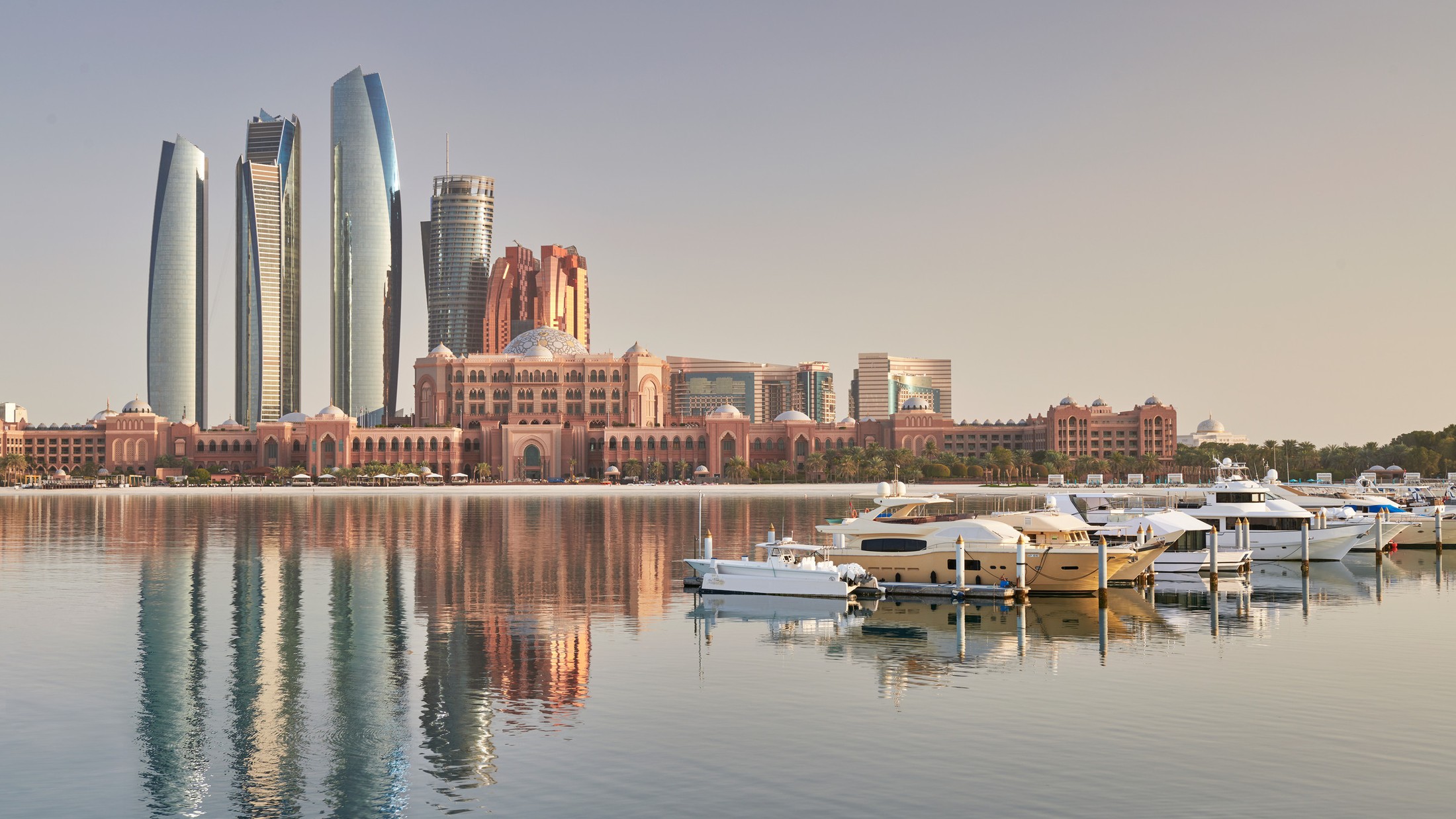 Emirates Palace and the Etihad Towers across the marina in Abu Dhabi