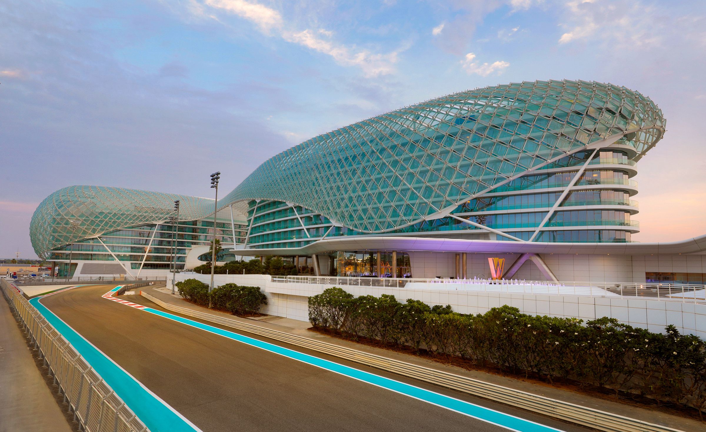 The W Abu Dhabi's lattice canopy over the Yas Marina Circuit on Yas Island at dusk