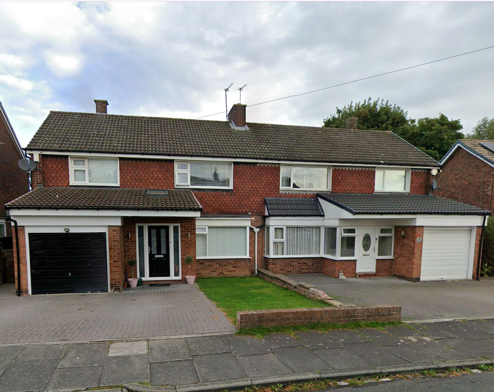 A pair of 1950s semi-detached brick houses with garages, bay windows and paved drives