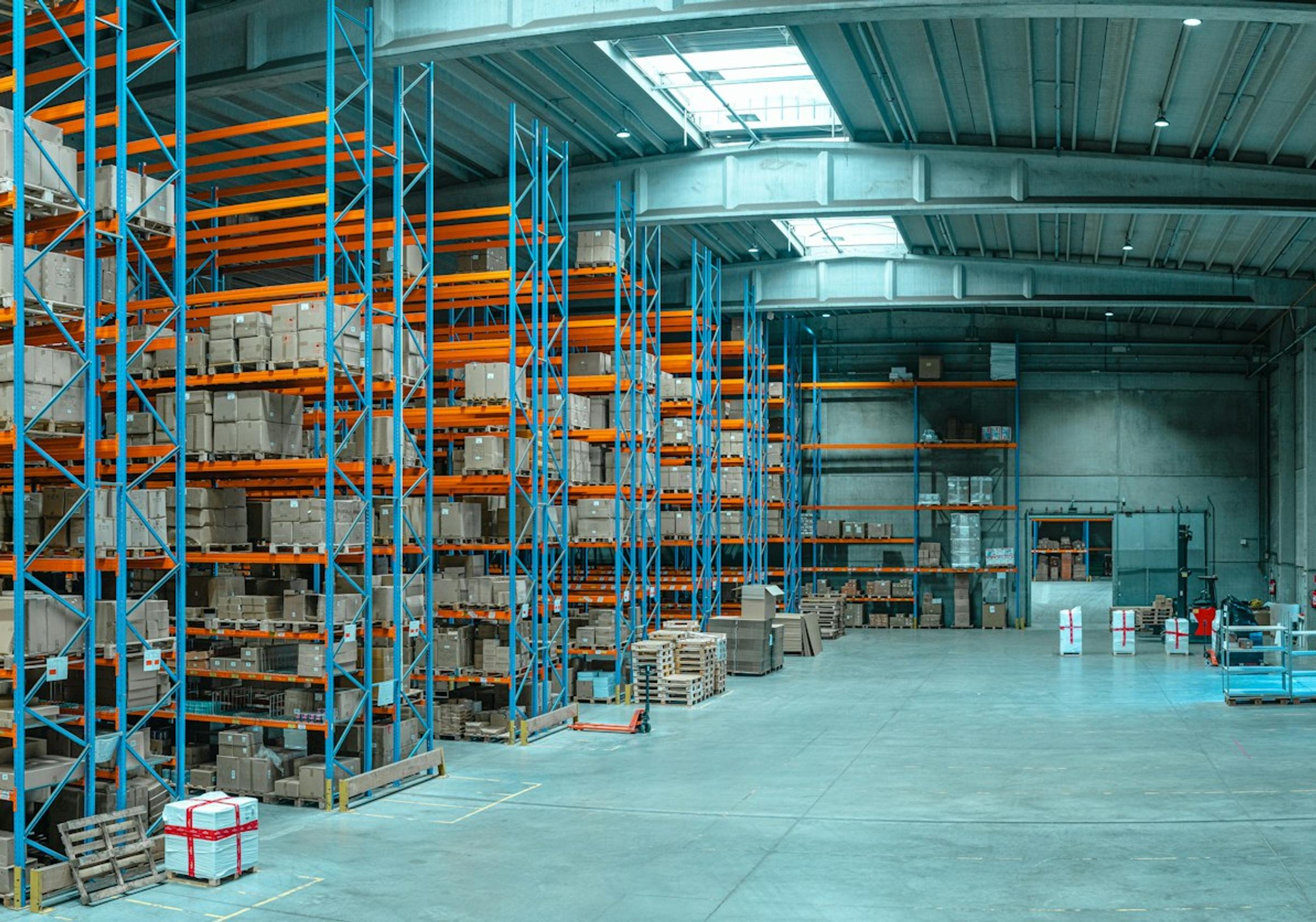 Tall shelving filled with boxes in a large warehouse
