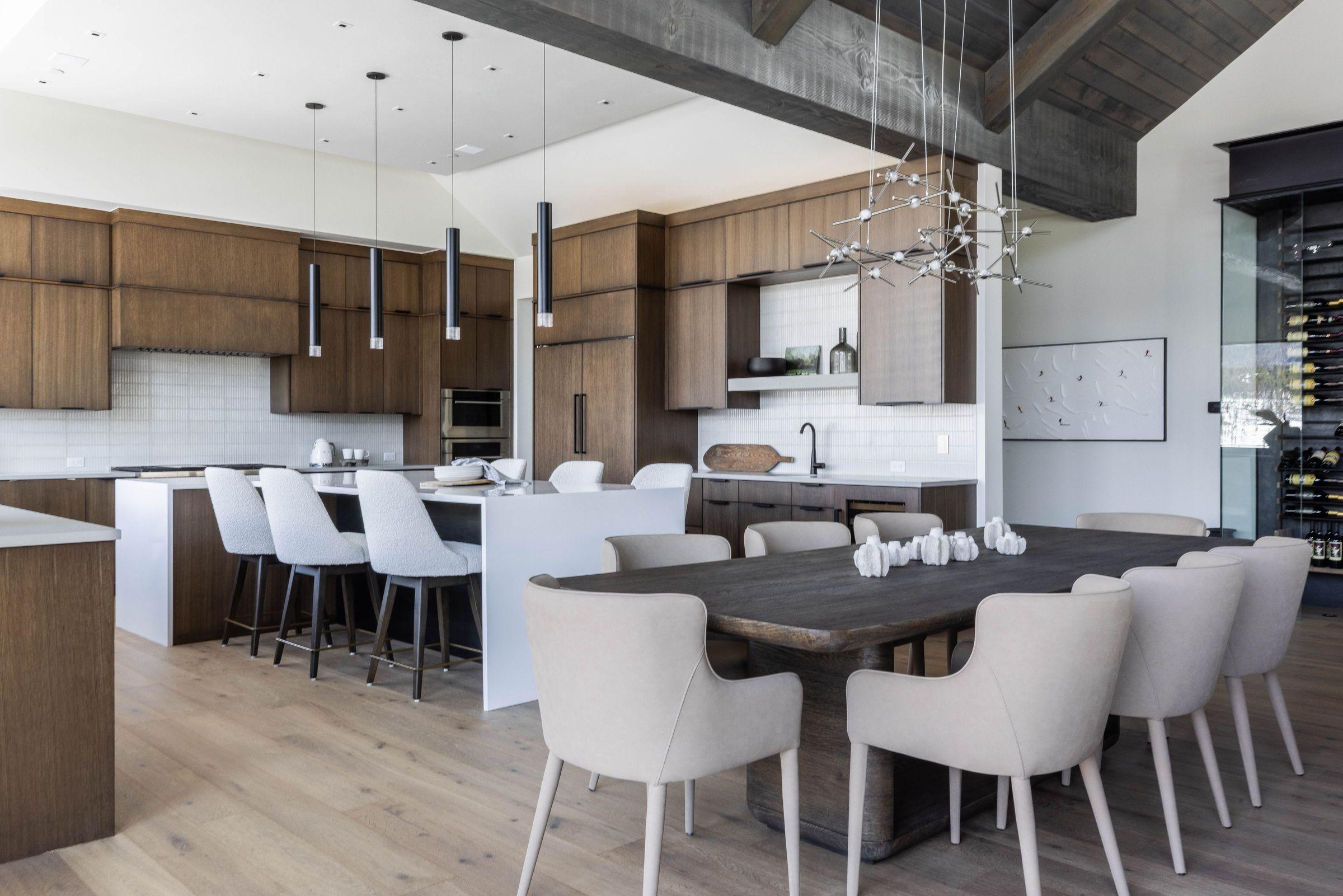Kitchen and dining in white with a long island