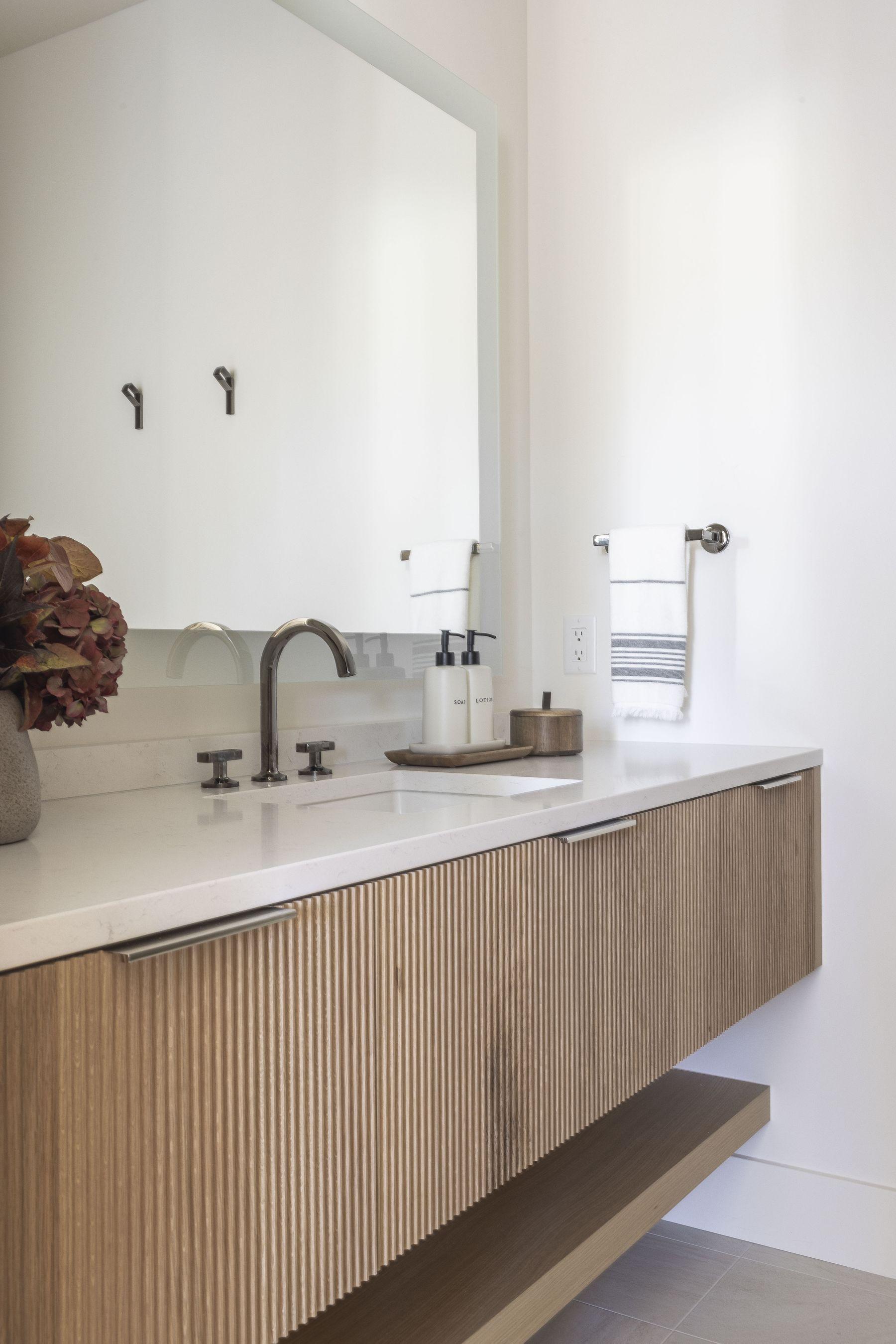 Bathroom with a freestanding tub beside the vanity