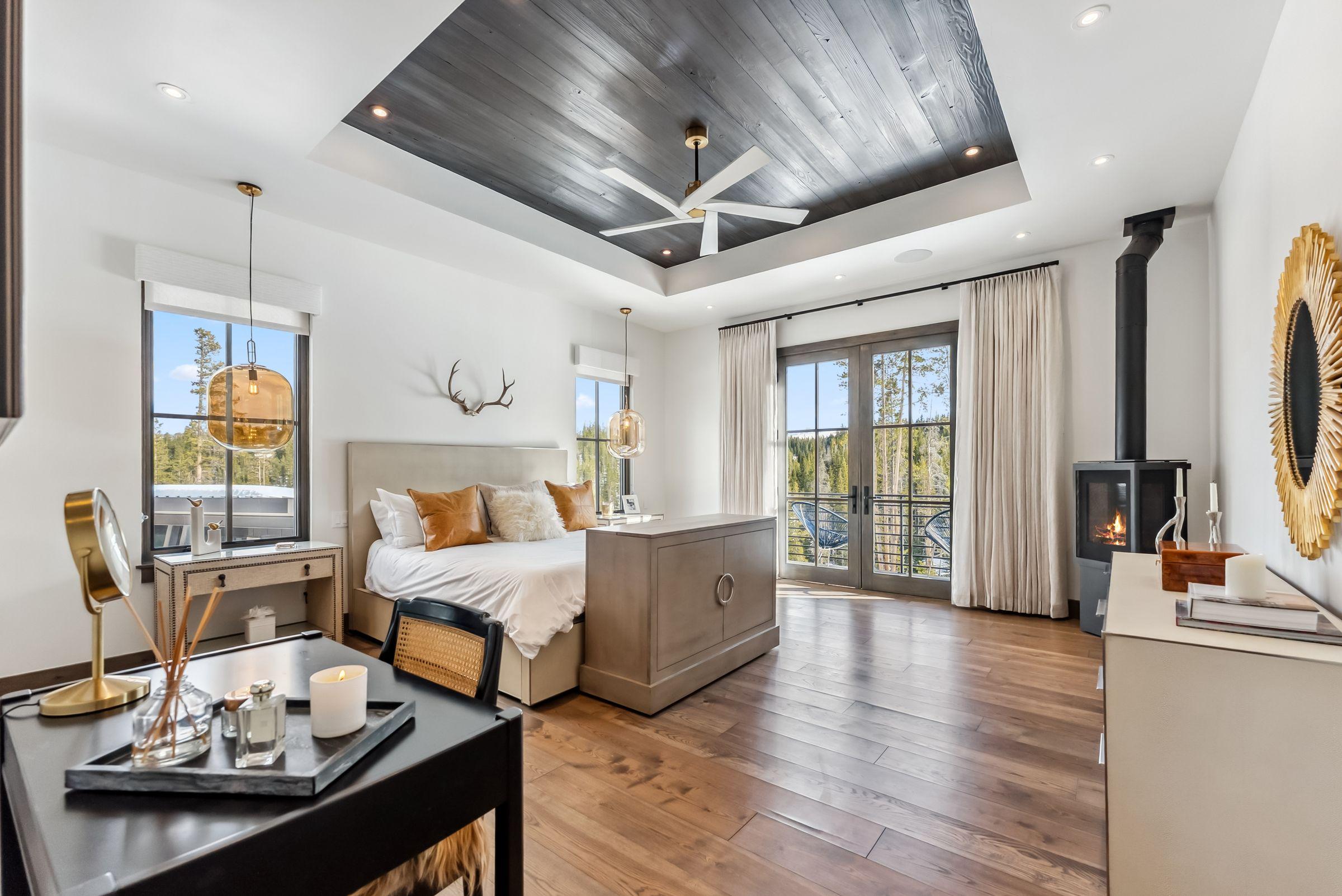 Living room fireplace, hardwood floors and a coffered ceiling