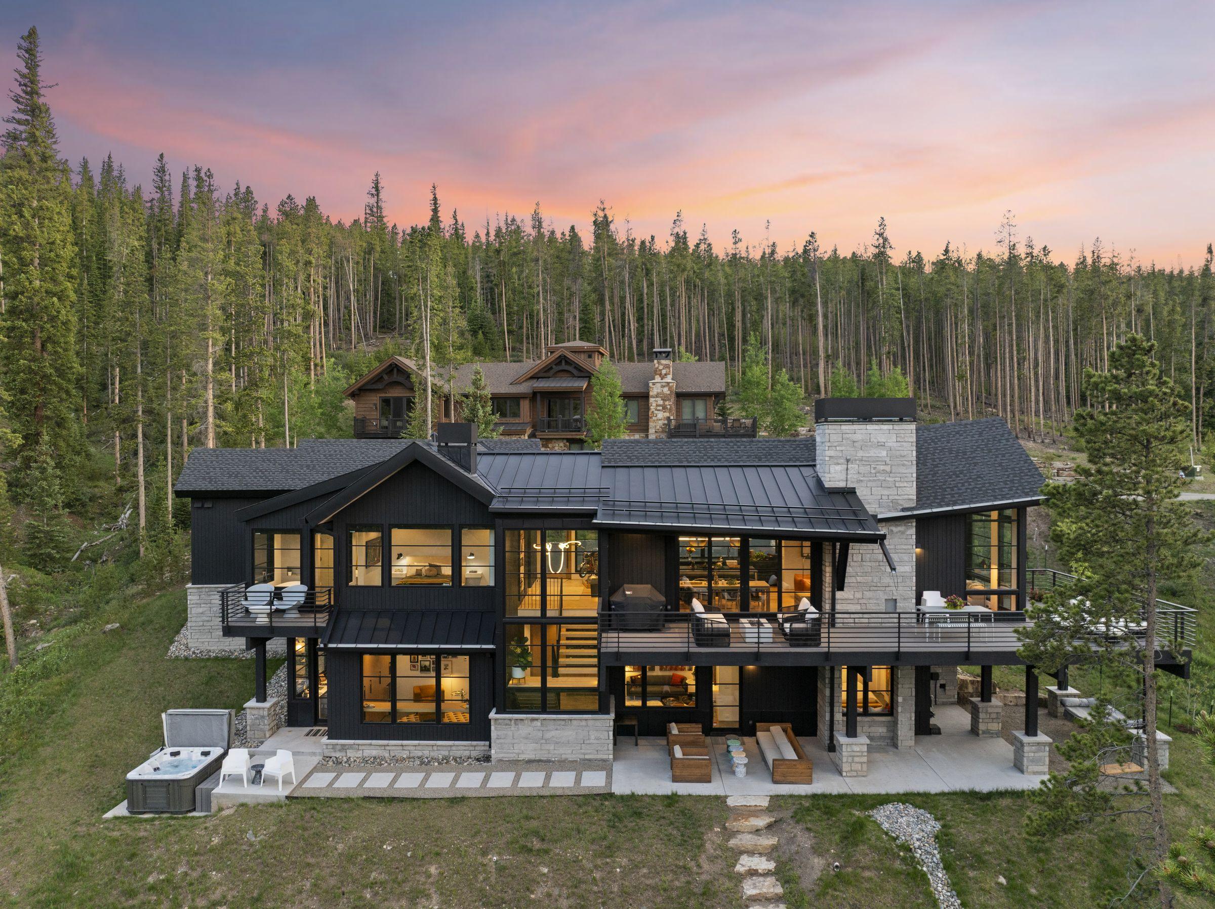 Exterior at dusk, lit from within, deep in the forest