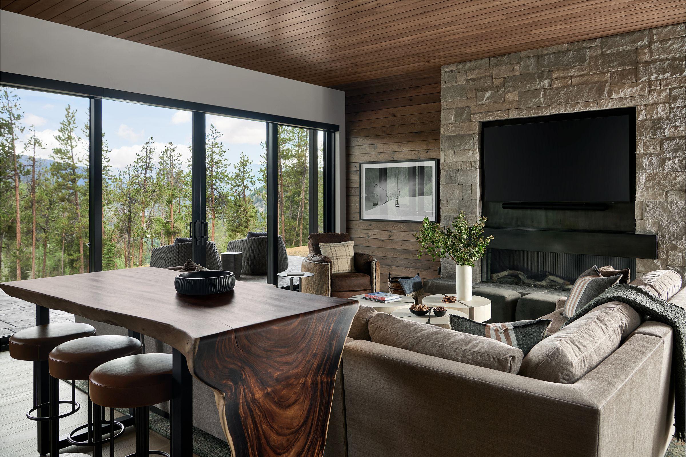 Great room seen from the dining end, sectional facing the fireplace