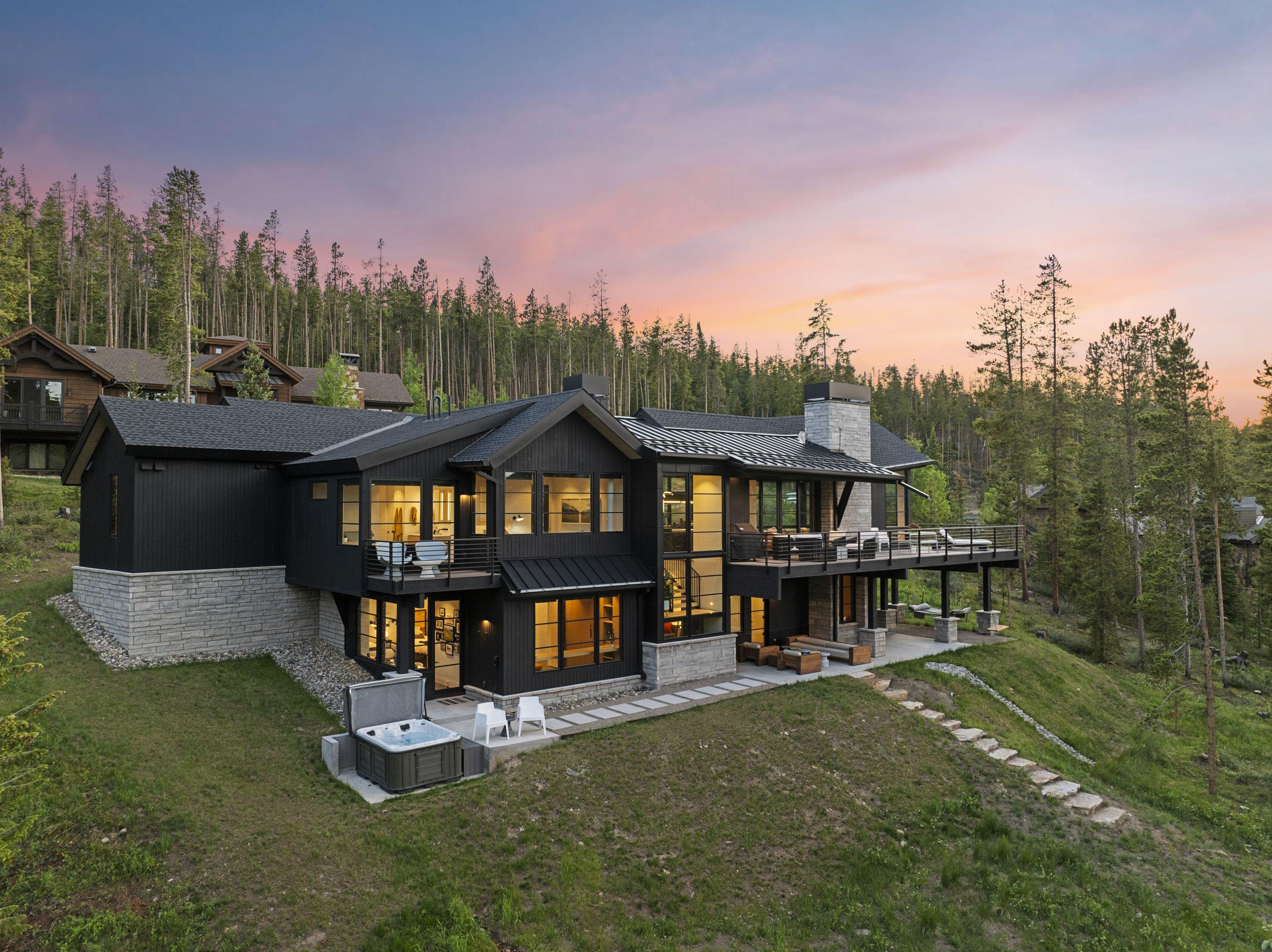 Aerial view of the Disco Scandi residence at sunset, set among the lodgepole pines