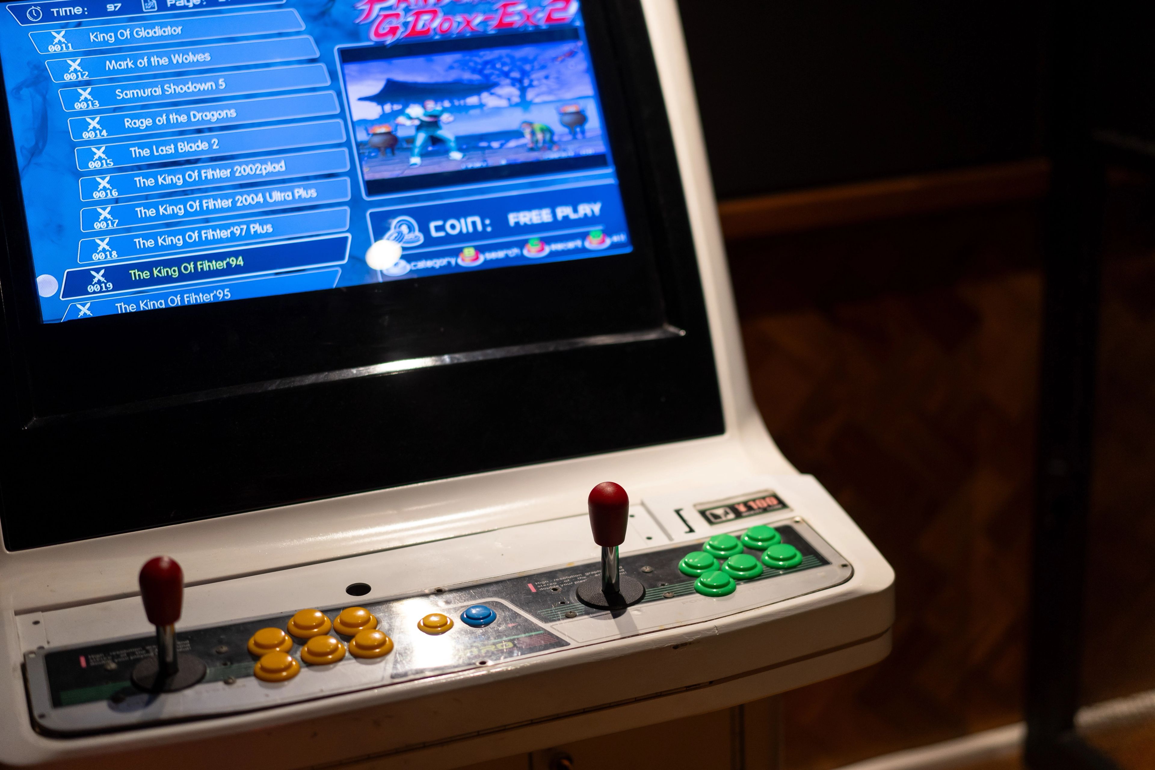 Arcade fighting game machine in the basement games room.
