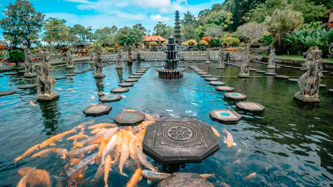 Stone stepping paths across the pools at Tirta Gangga water palace.