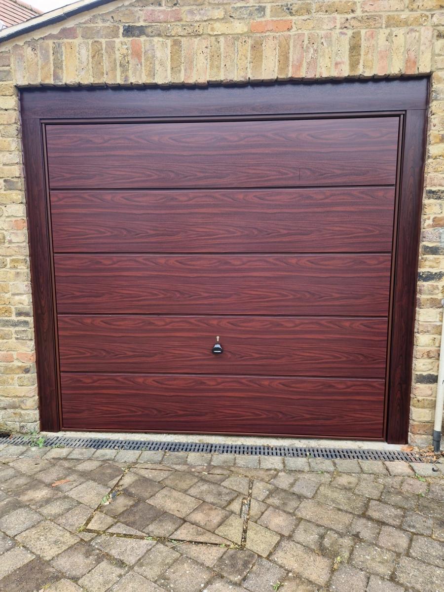Rosewood woodgrain up-and-over garage door