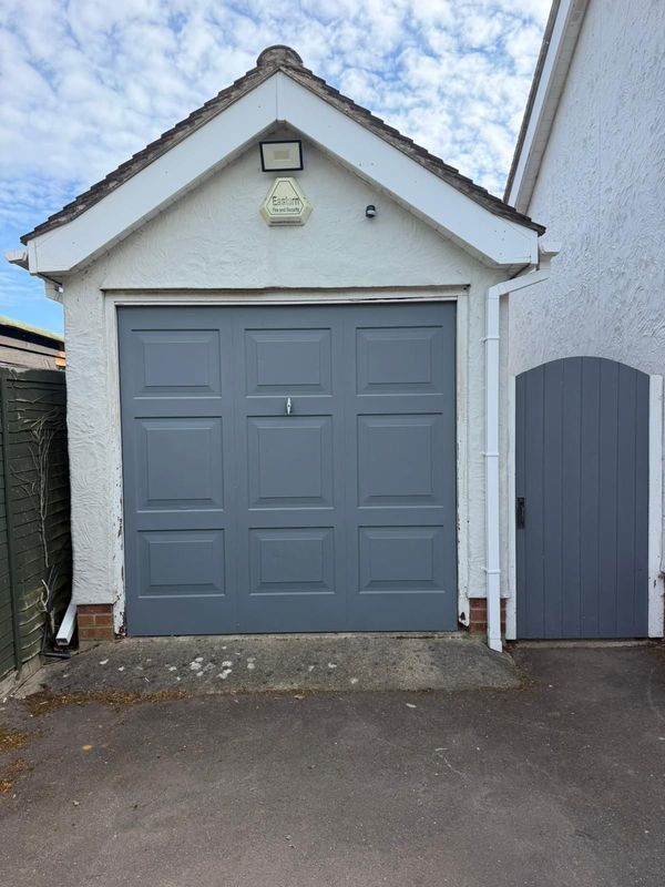Old and tired up-and-over garage doors in Bishop's Stortford