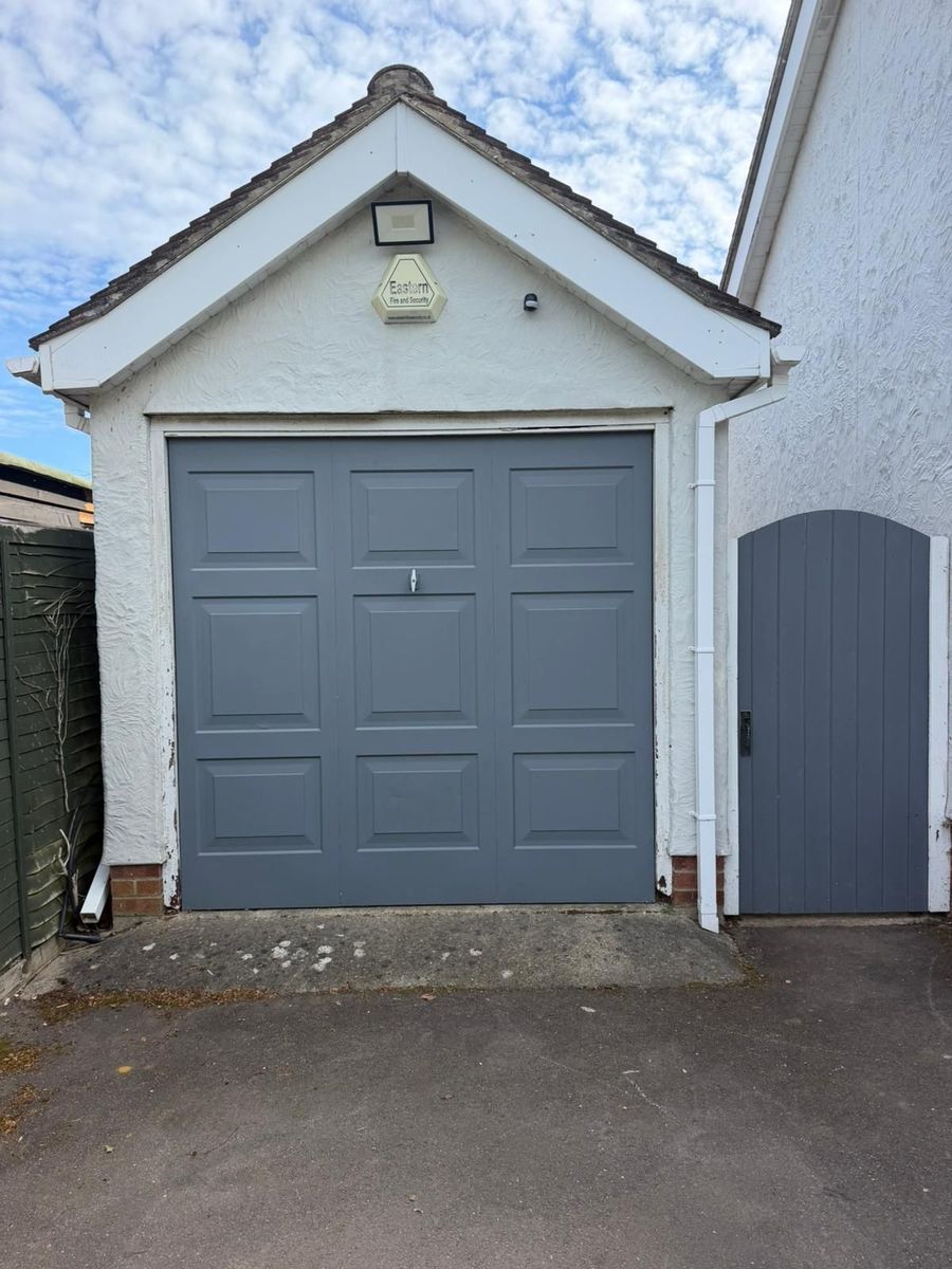 Old and tired up-and-over garage doors in Bishop's Stortford