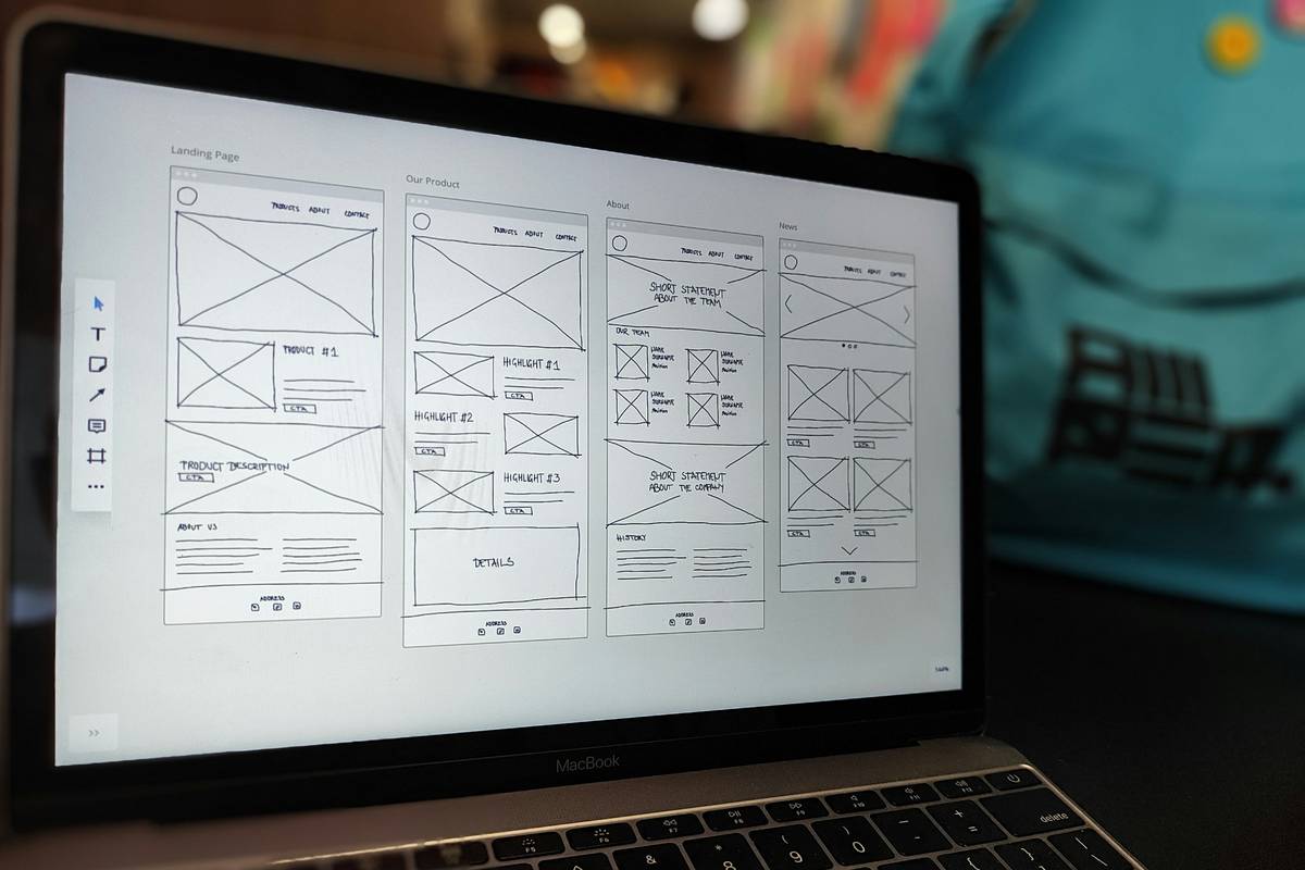 Founder at a laptop comparing Bubble vs custom code for building a new app