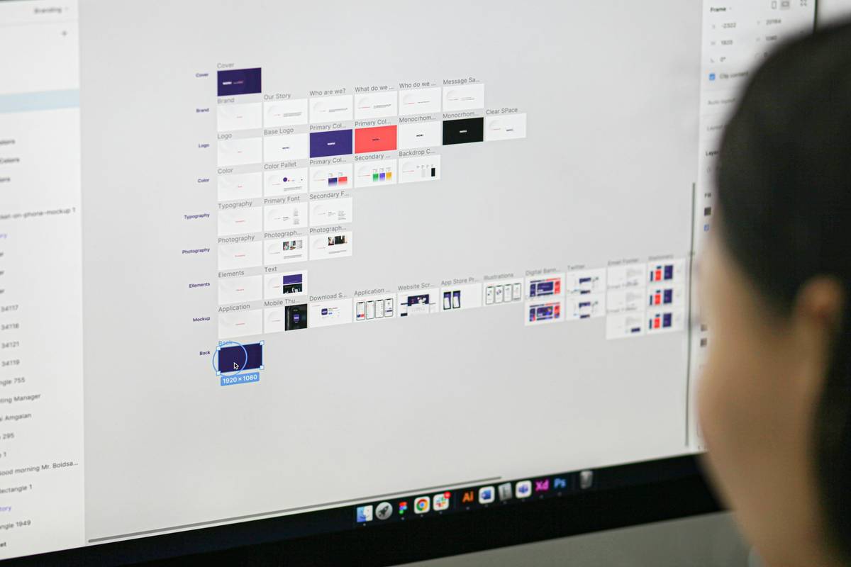 a woman is looking at a computer screen