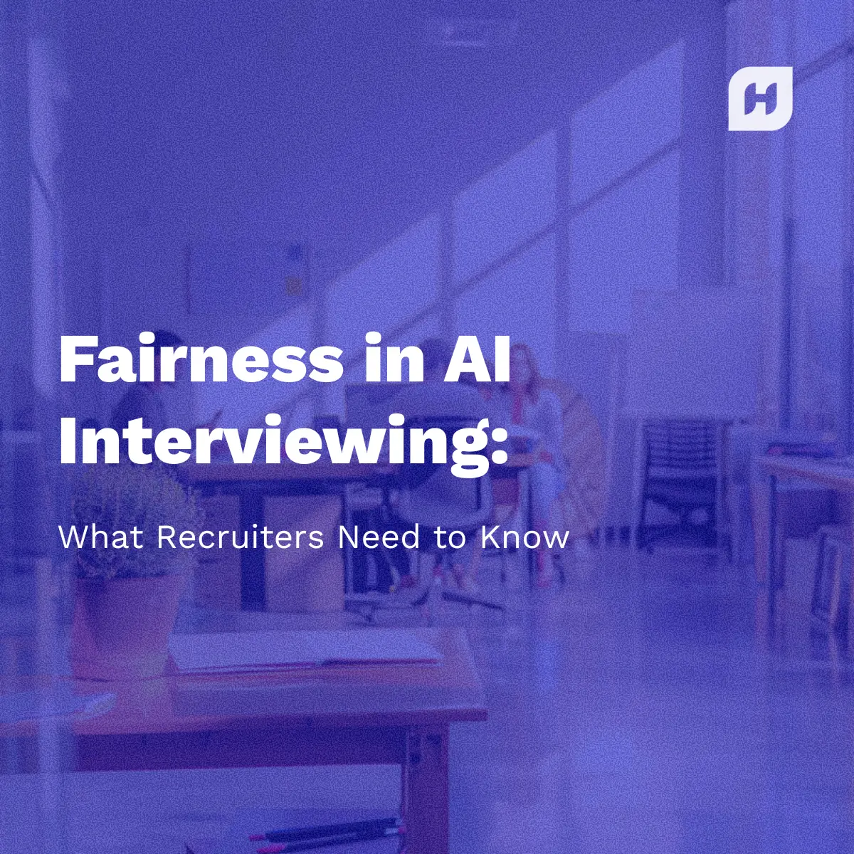 A white paper or guide cover titled "Fairness in AI Interviewing: What Recruiters Need to Know" in large white text. The subtitle reads "2025 Comparison Guide (Feature Matrix Inside)". The Humanly 'H' logo is in the top right corner, and the text is overlayed on a dark blue-tinted photo of people working in a modern, brightly lit office space.