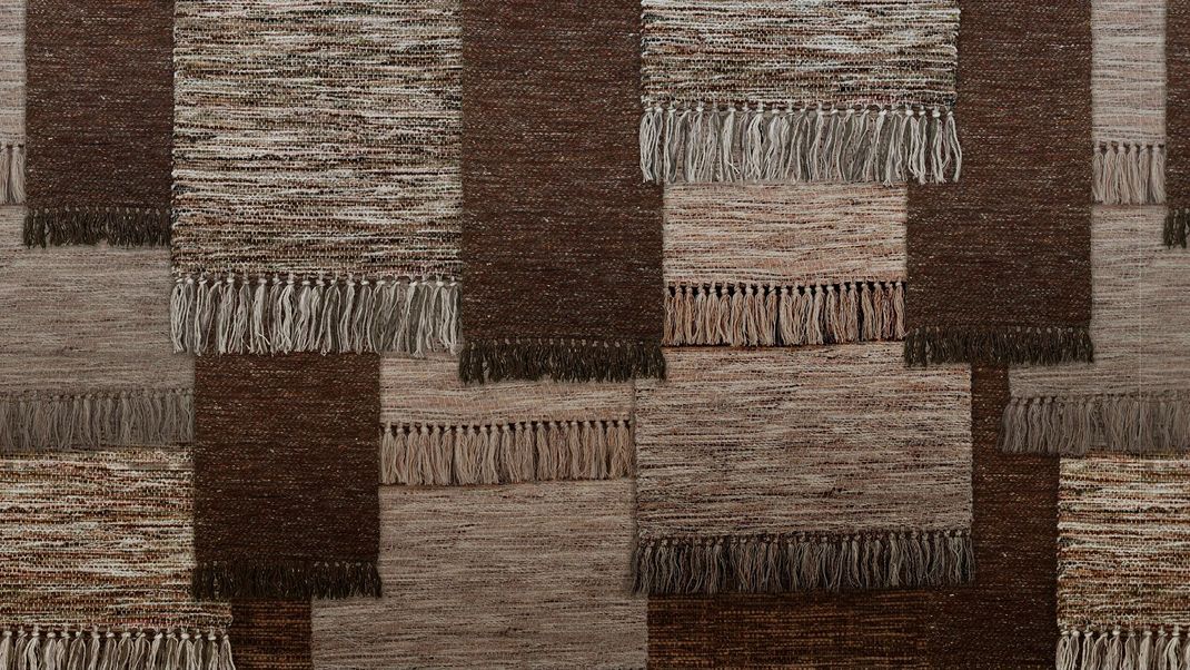 Brown wallpaper with various woven cloths.