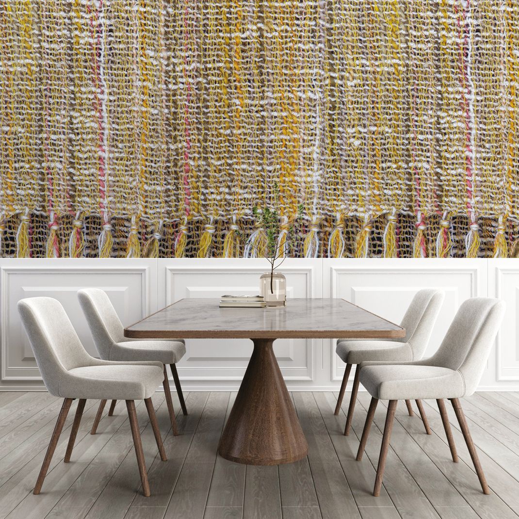 Yellow-colored wallpaper with large woven pattern.