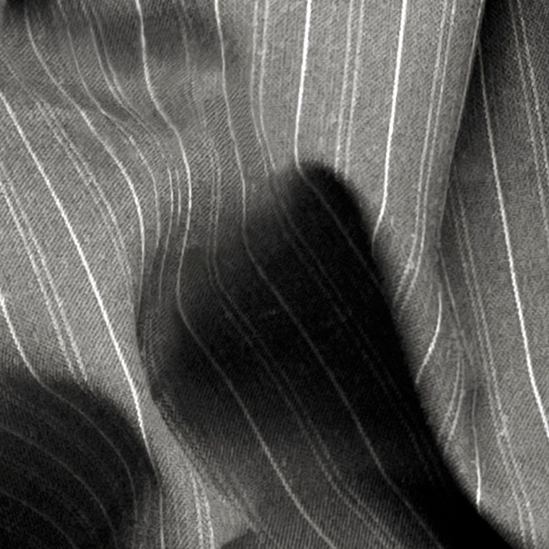 Grey wallpaper with folded textile