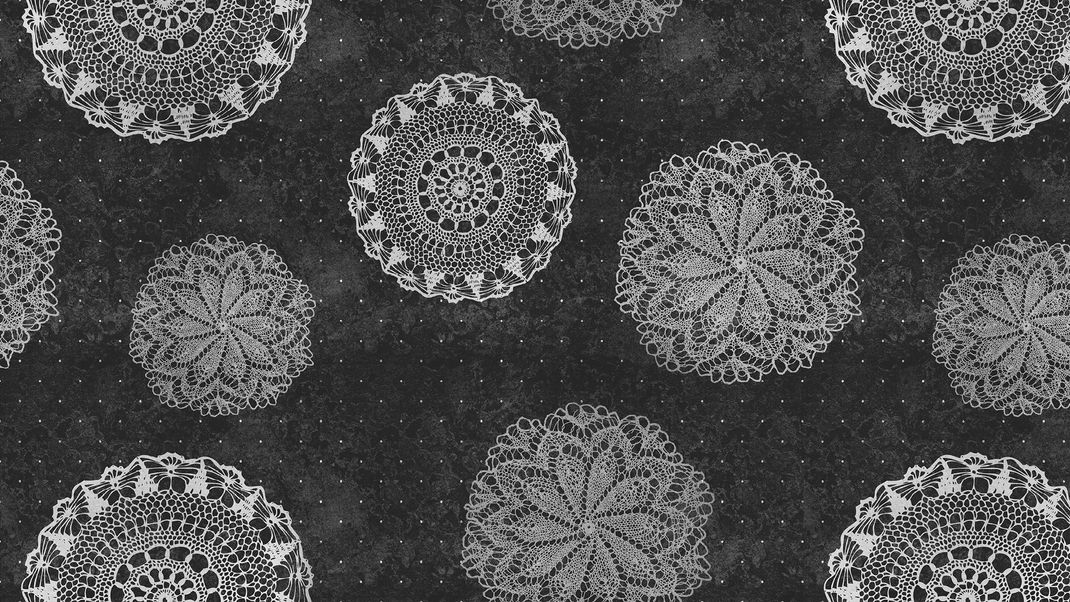 Black and white wallpaper with round lace doilies