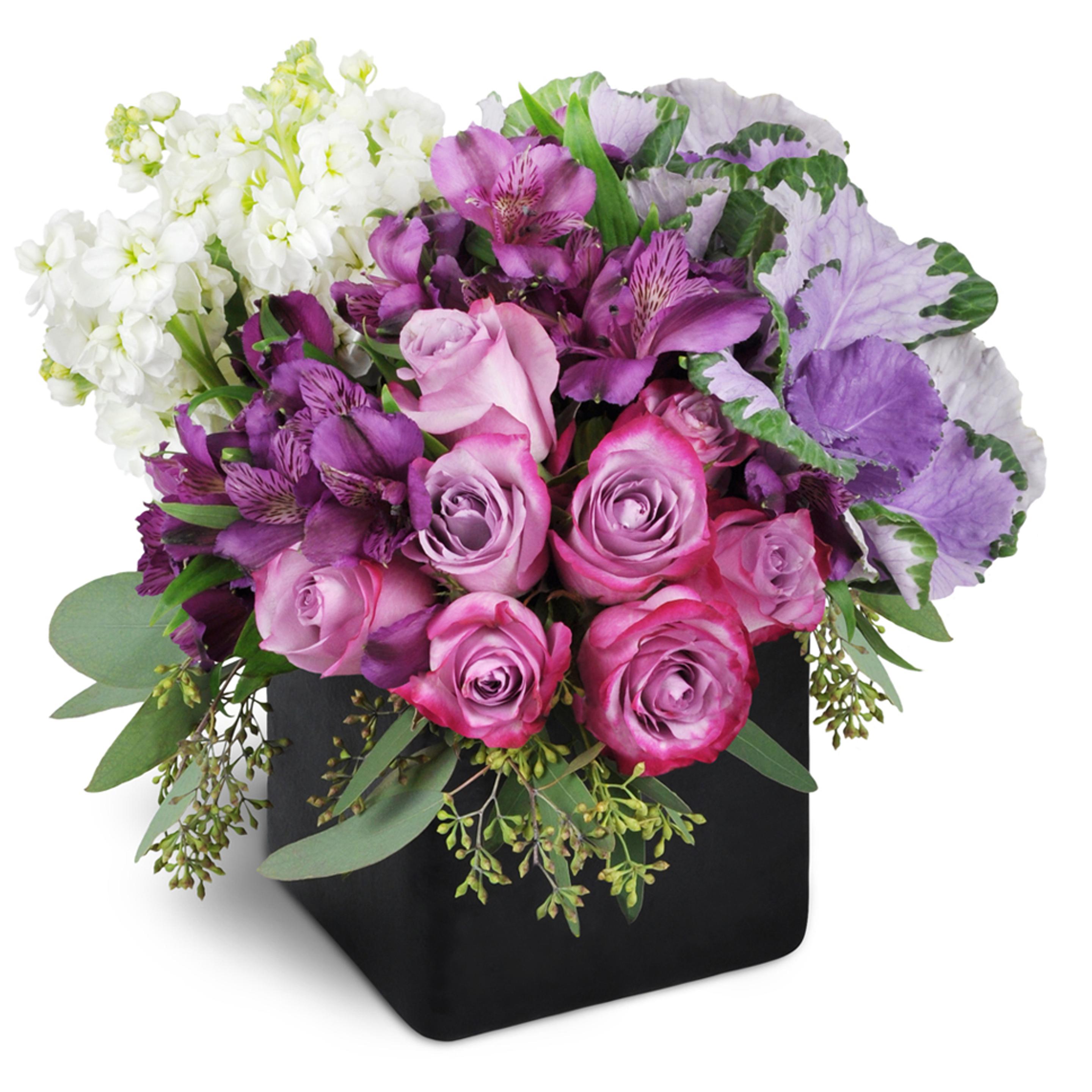 Purple flower arrangement with  lavender roses and purple Peruvian lilies.
