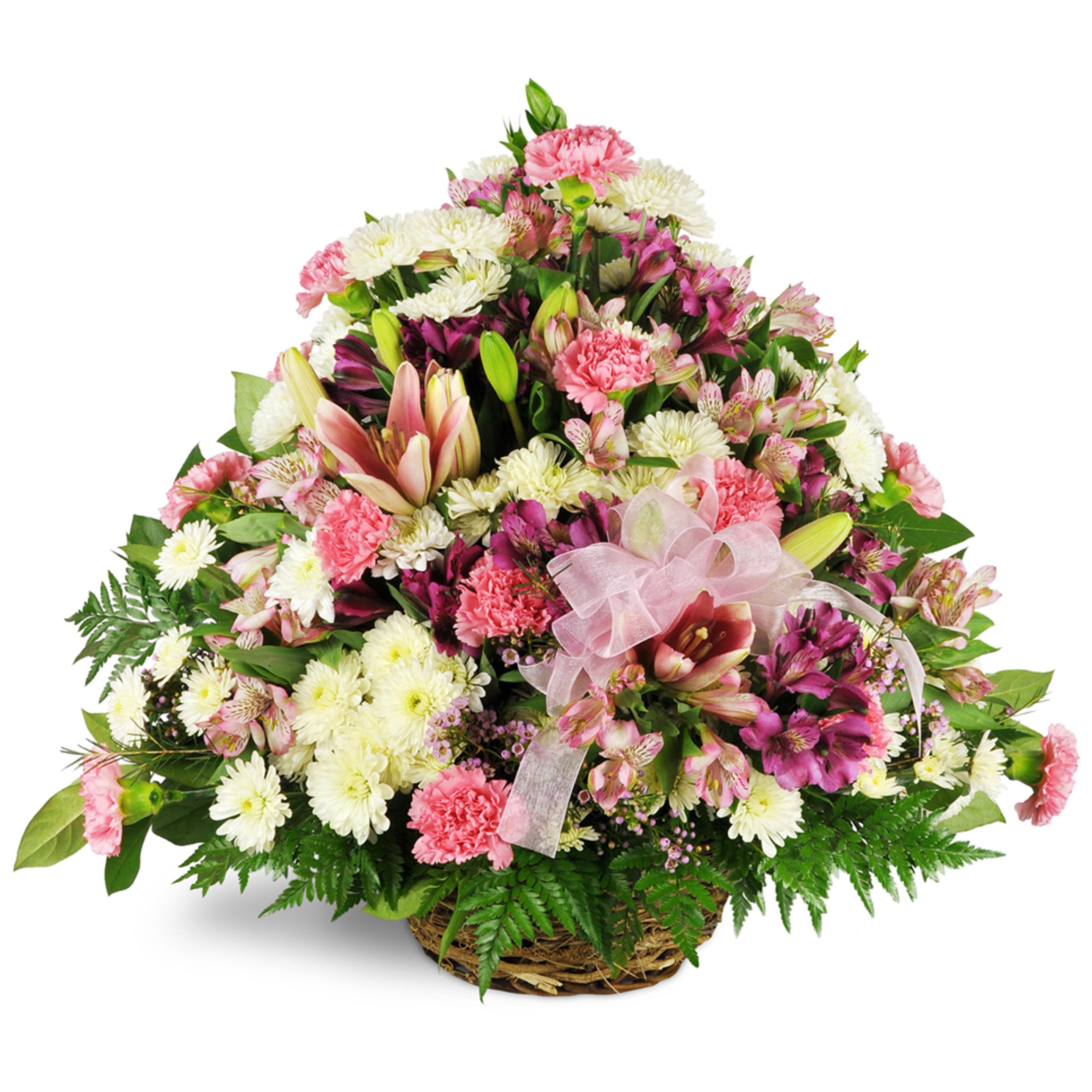 A beautiful gift basket bursting with flowers to express condolences for sympathy.