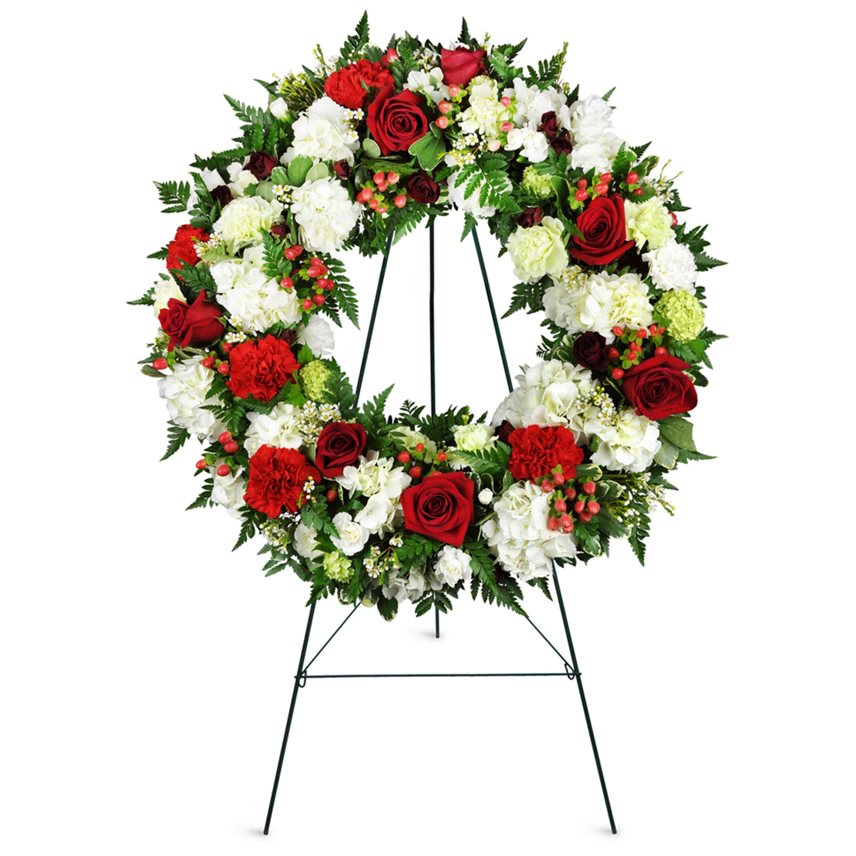 Standing spray wreath with red and white flowers and green accents. An ever looping sign perfect tribute for funerals and sympathy.