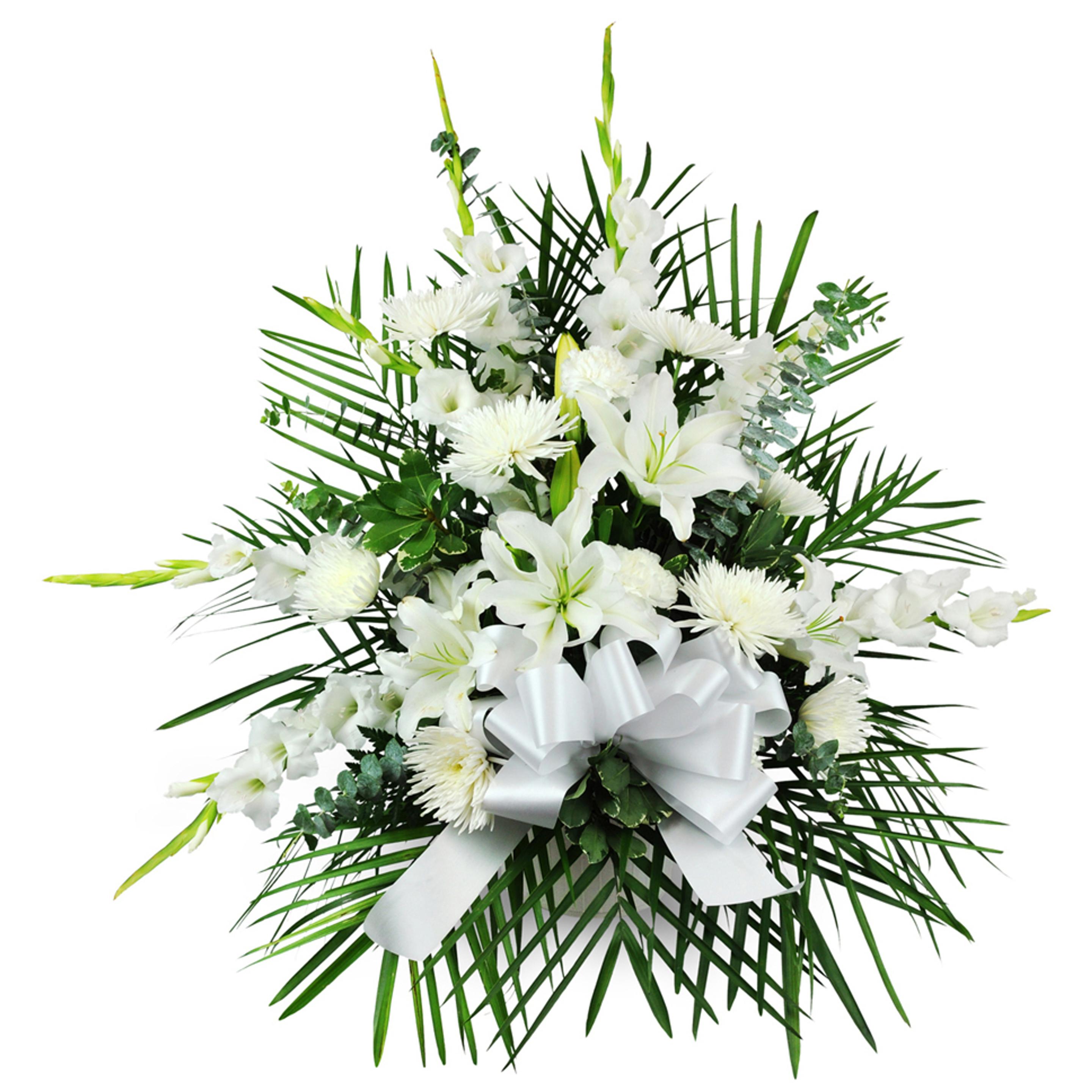 A white ribbon tied around an elegant and thoughtful white floral arrangement for sympathy.