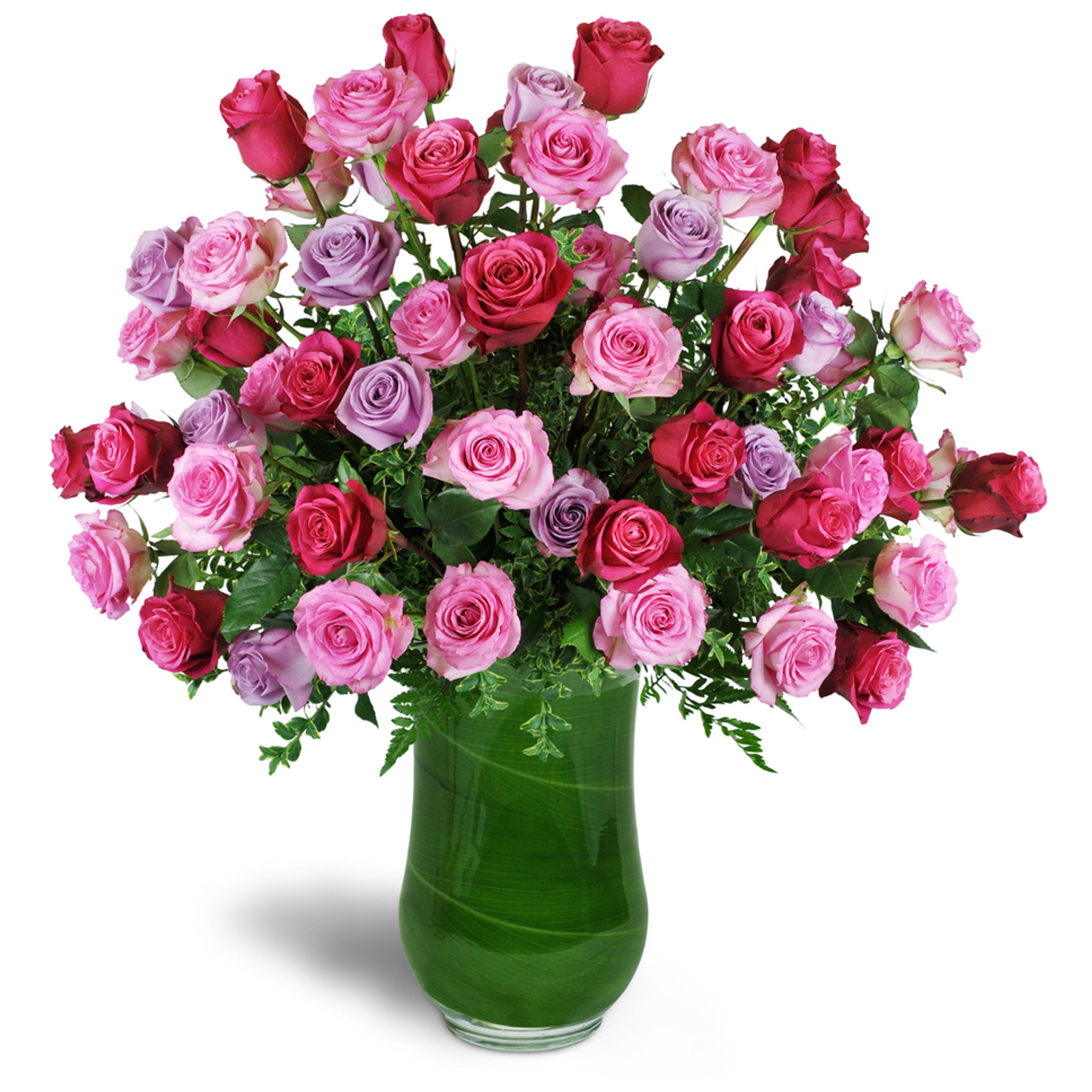 Pink flower arrangement - dozen premium roses in fuchsia, pink, and lavender are expertly arranged in a clear vase.