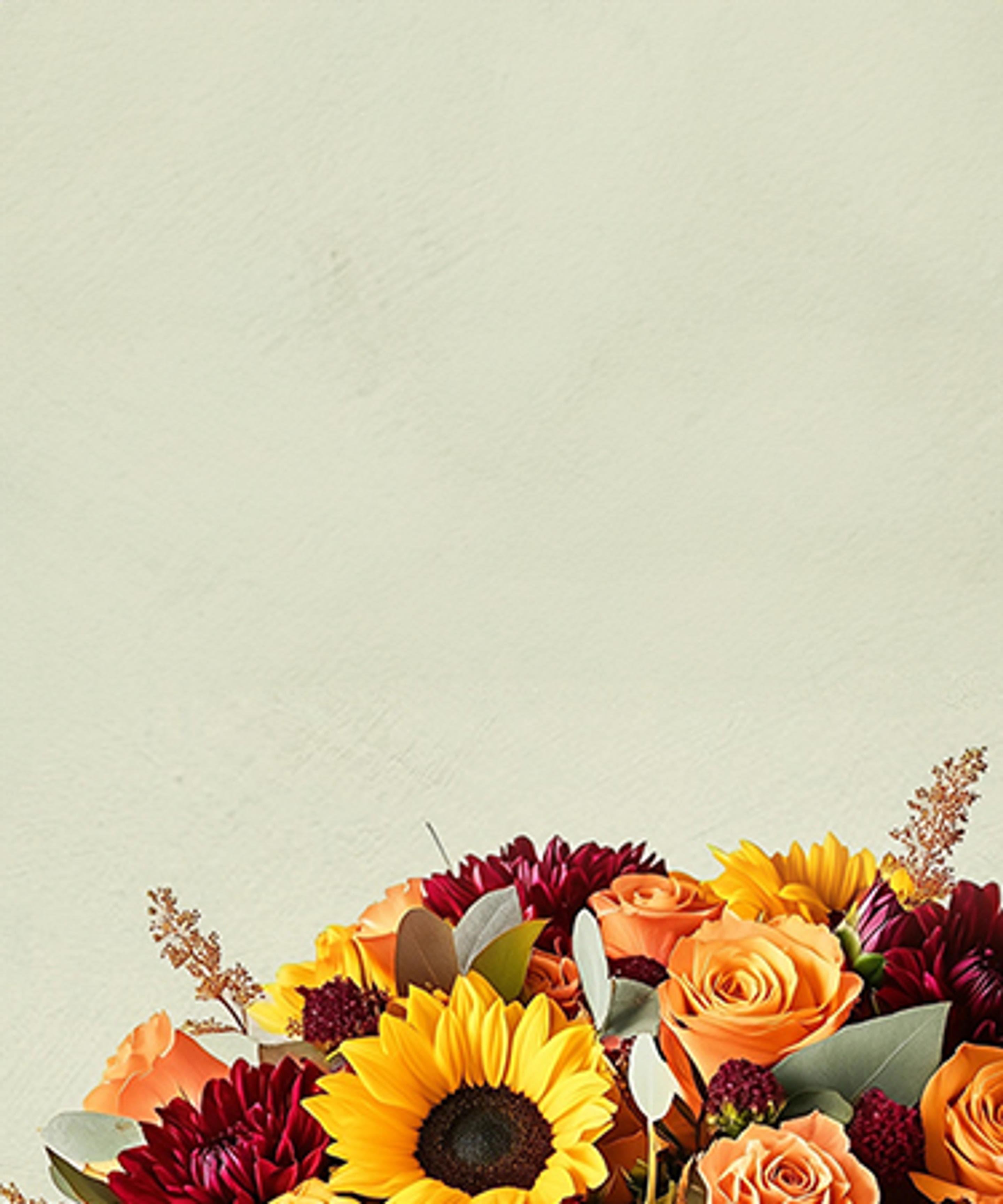 Fall flower arrangement with sunflowers, red and orange roses, and chrysanthemums.