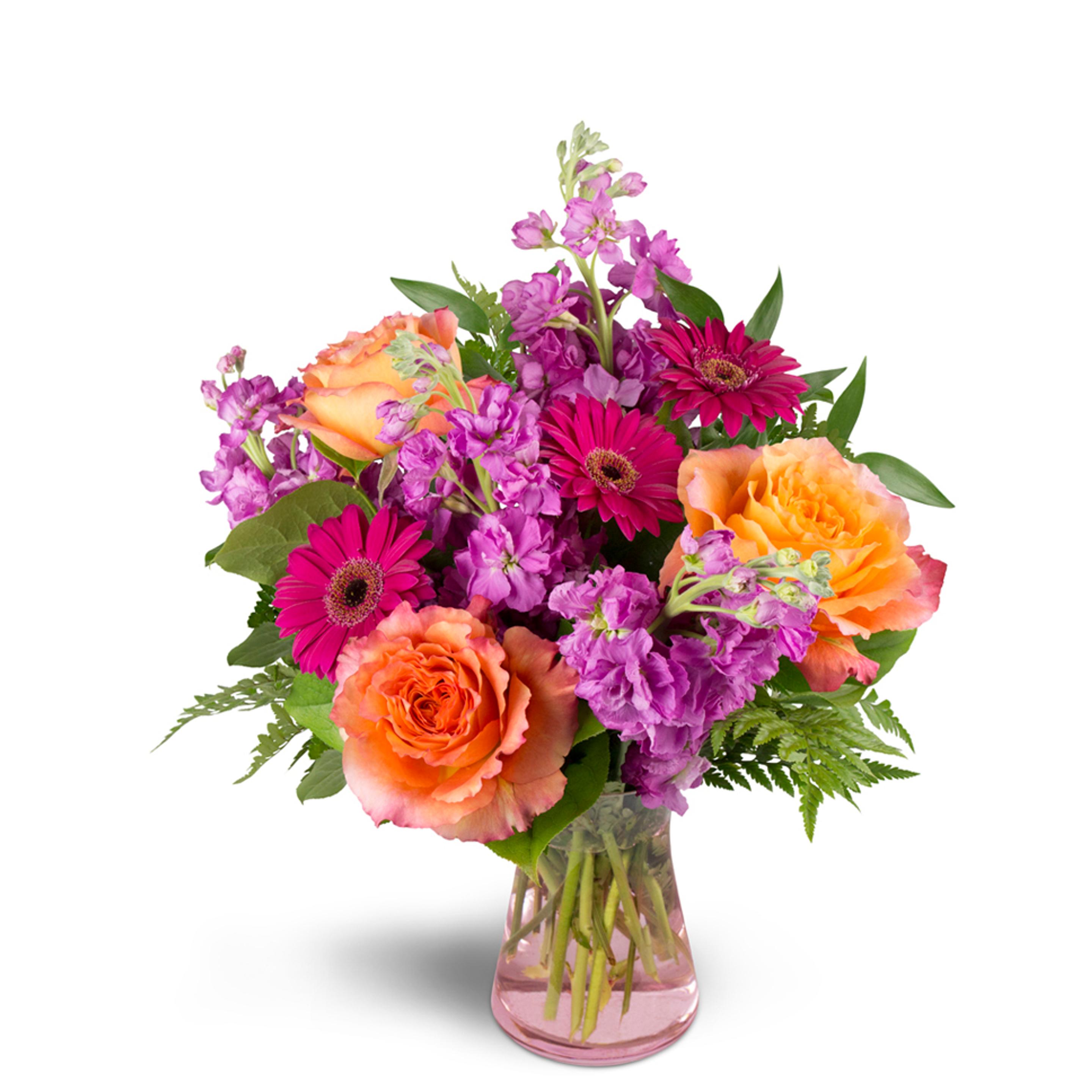 A bright arrangement with orange and pink perfect for celebrating a birthday.