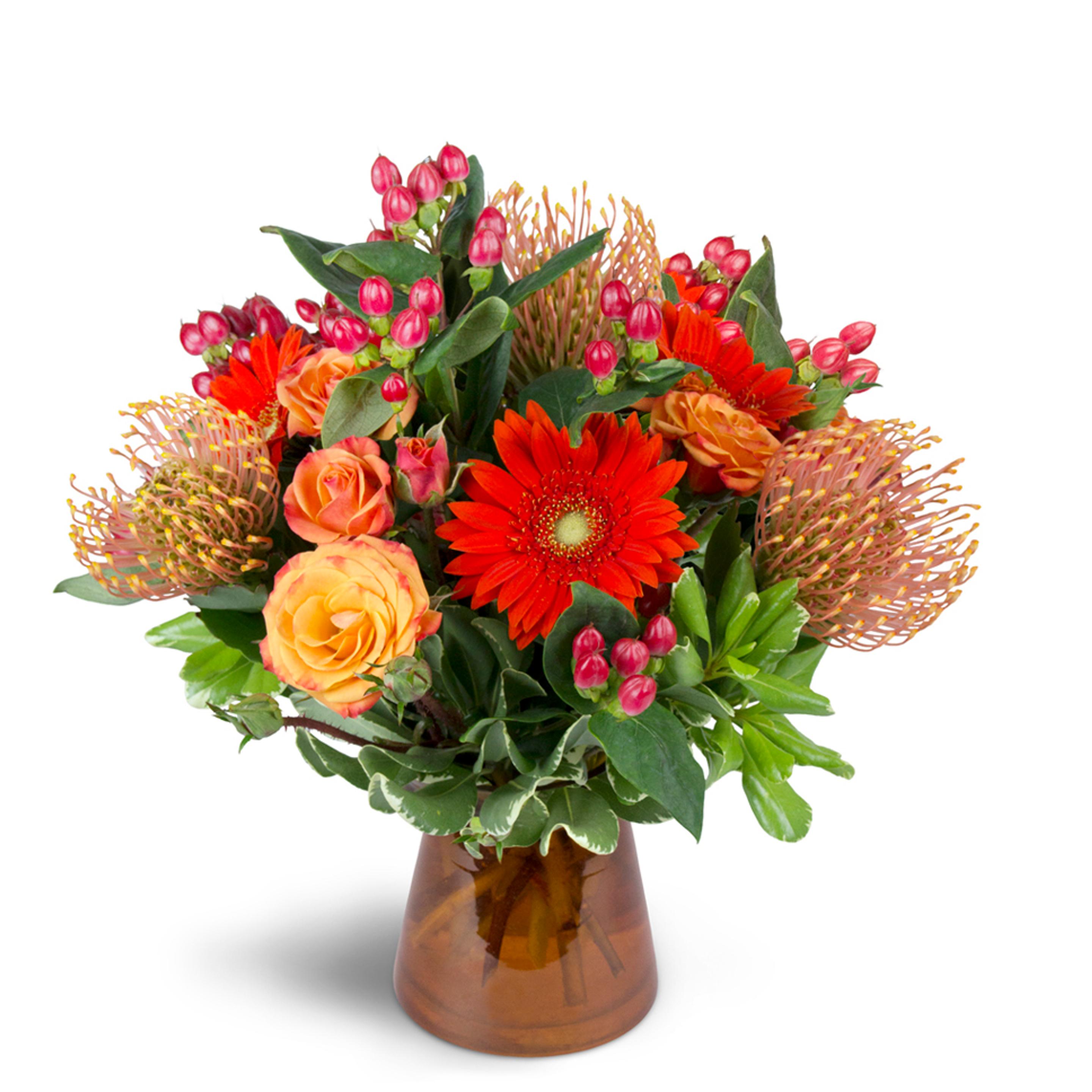 Orange flower arrangement - pincushion protea are arranged with orange spray roses, mini Gerbera daisies, and more.
