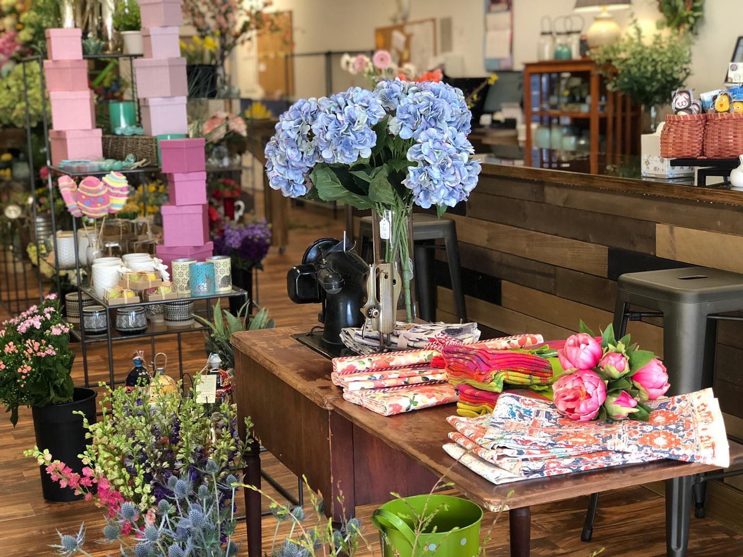 Lovingly Fishkill - Flowers by Reni interior flower shop with a view on a table with gifts and flowers