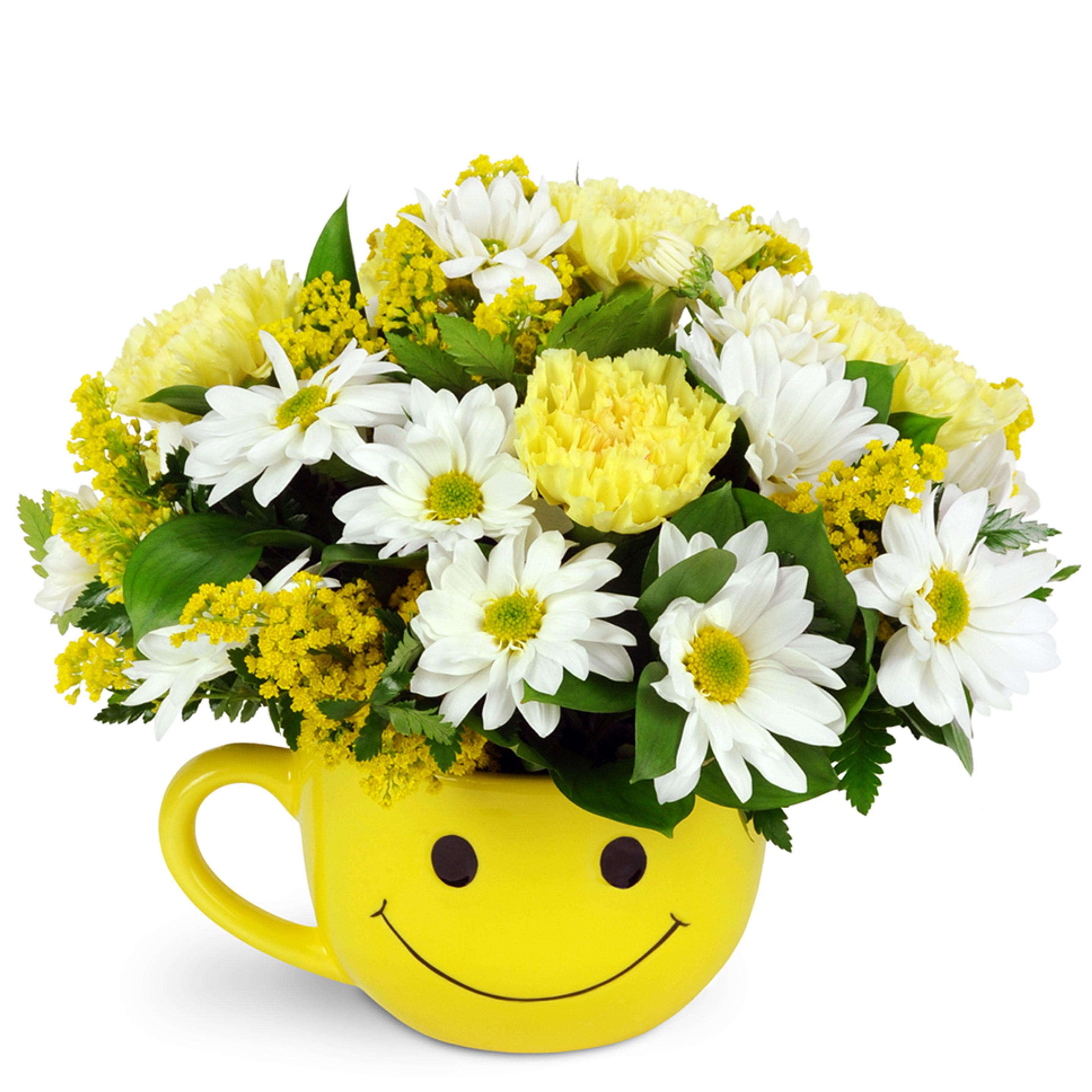 Full of smiles flowers in a smiling yellow mug to represent First Birthday