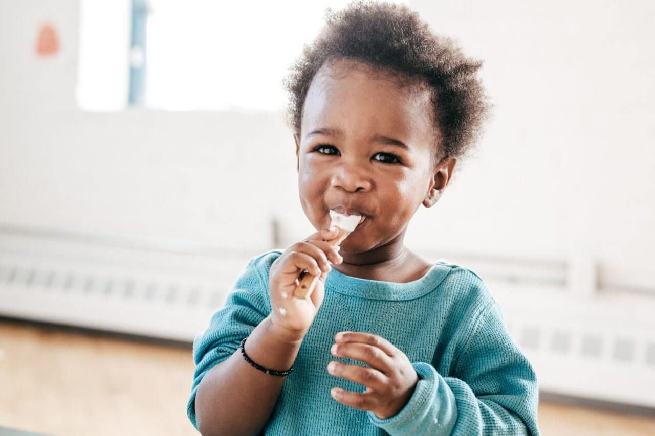 A happy child eating