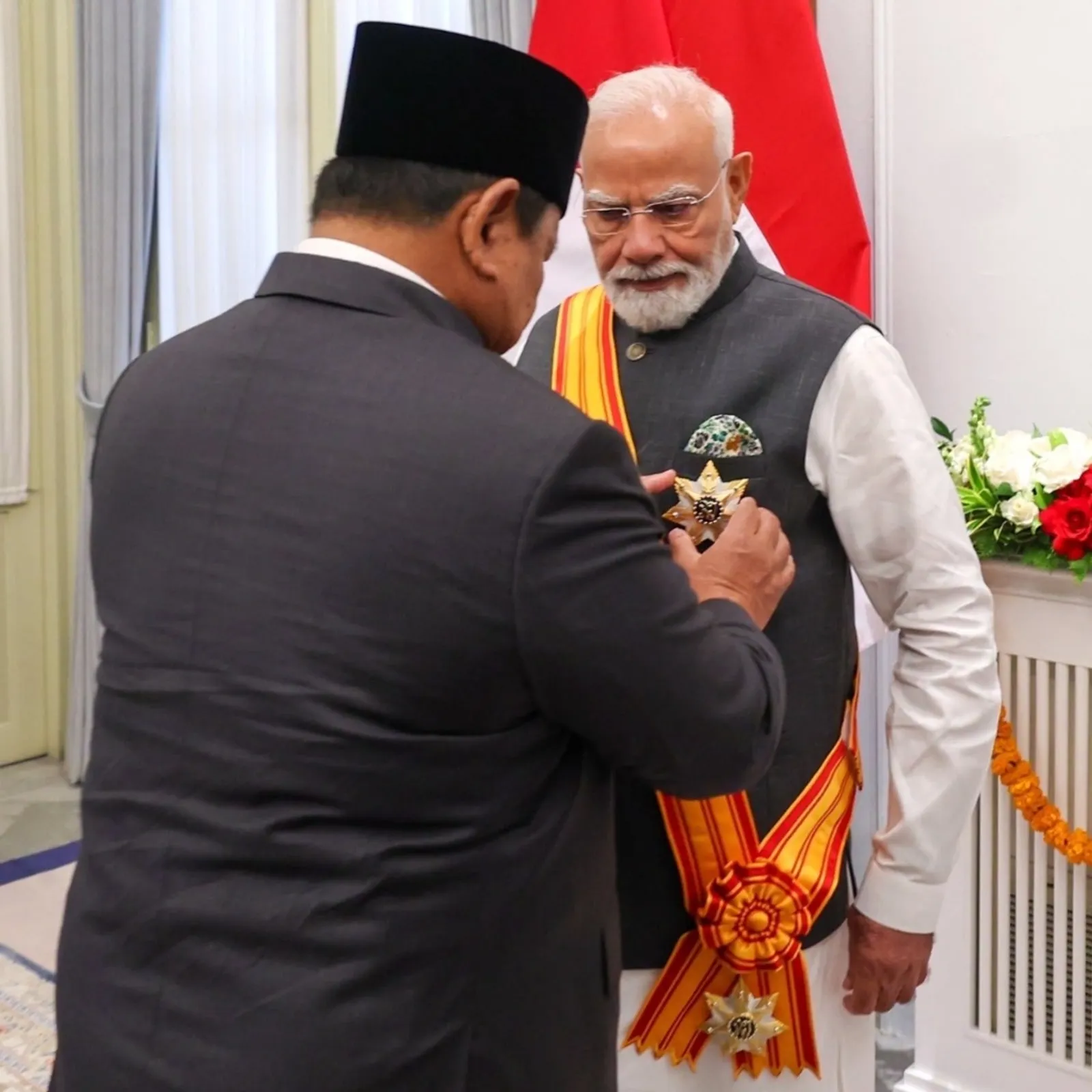 President Prabowo Subianto pinning Bintang Adipurna on PM Modi