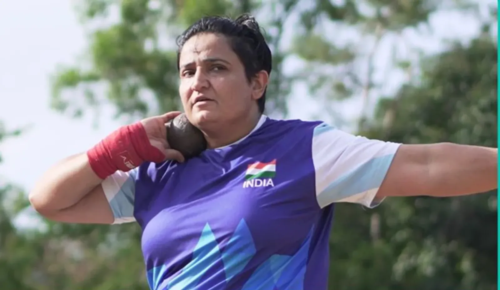 Sharmila Dhankar performing Shot Put F57 throw with intense concentration