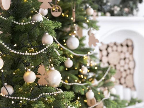 Closeup of a Christmas tree with carefully arranged pet friendly holiday decor, safe for dogs and cats