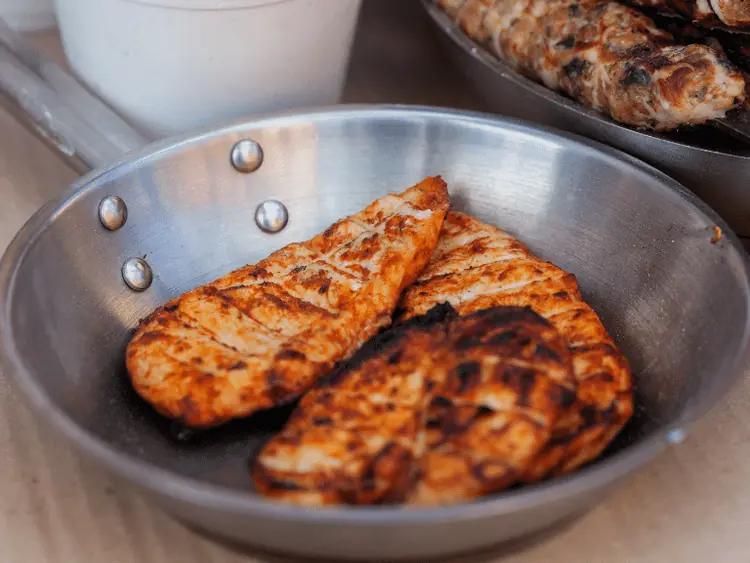 Cooked unseasoned chicken, one of the healthiest human foods that dogs can eat