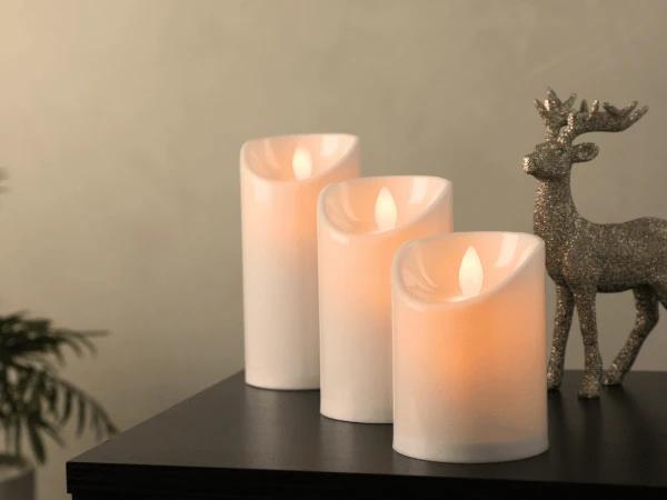 Three LED candles, pet friendly holiday decor pieces that are good for warm, welcoming lighting