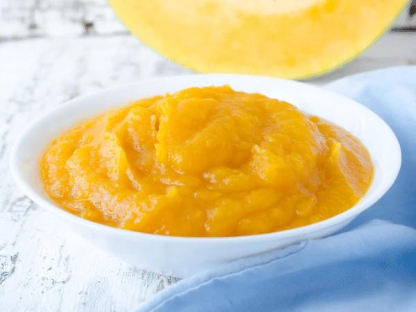 Cooked, unseasoned, pureed pumpkin, a pet-friendly food topper for a cat Christmas dinner or dog Christmas dinner