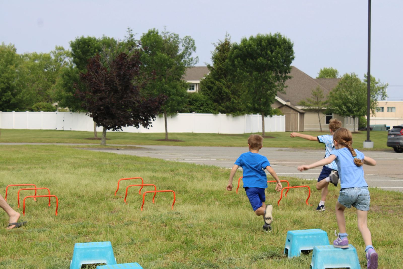 SELA students playing soccer on the field