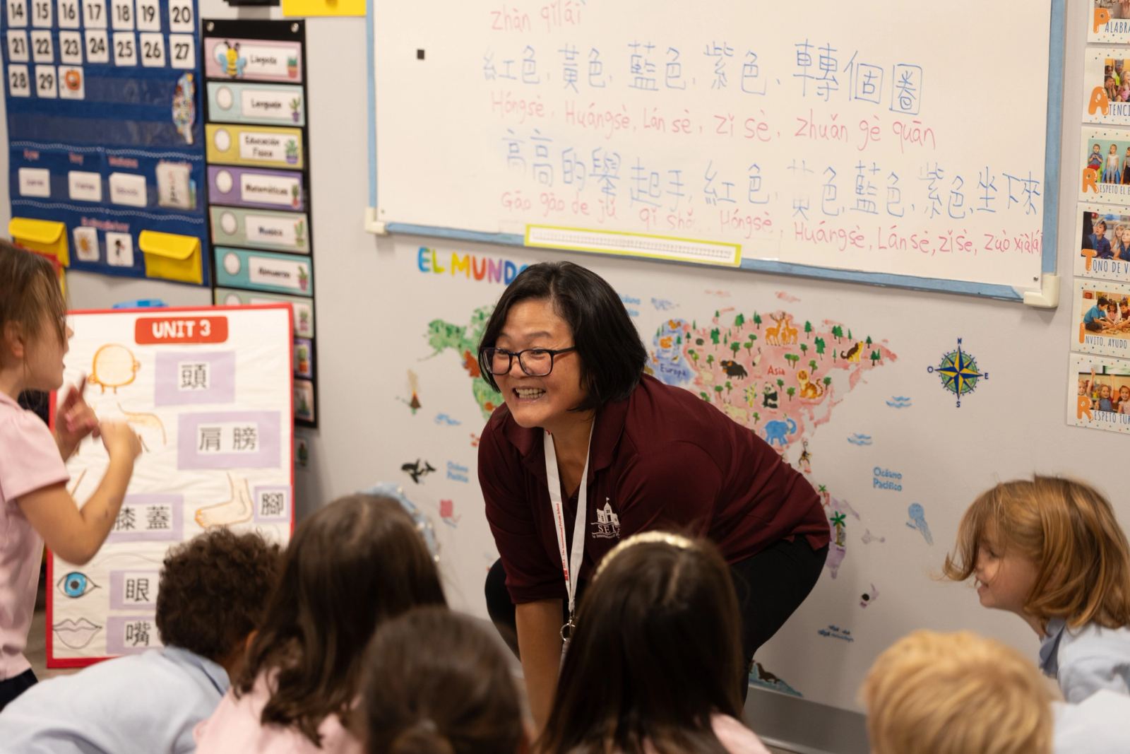 A SELA Mandarin teacher smiling with her JuniorK class during a madarin lesson.