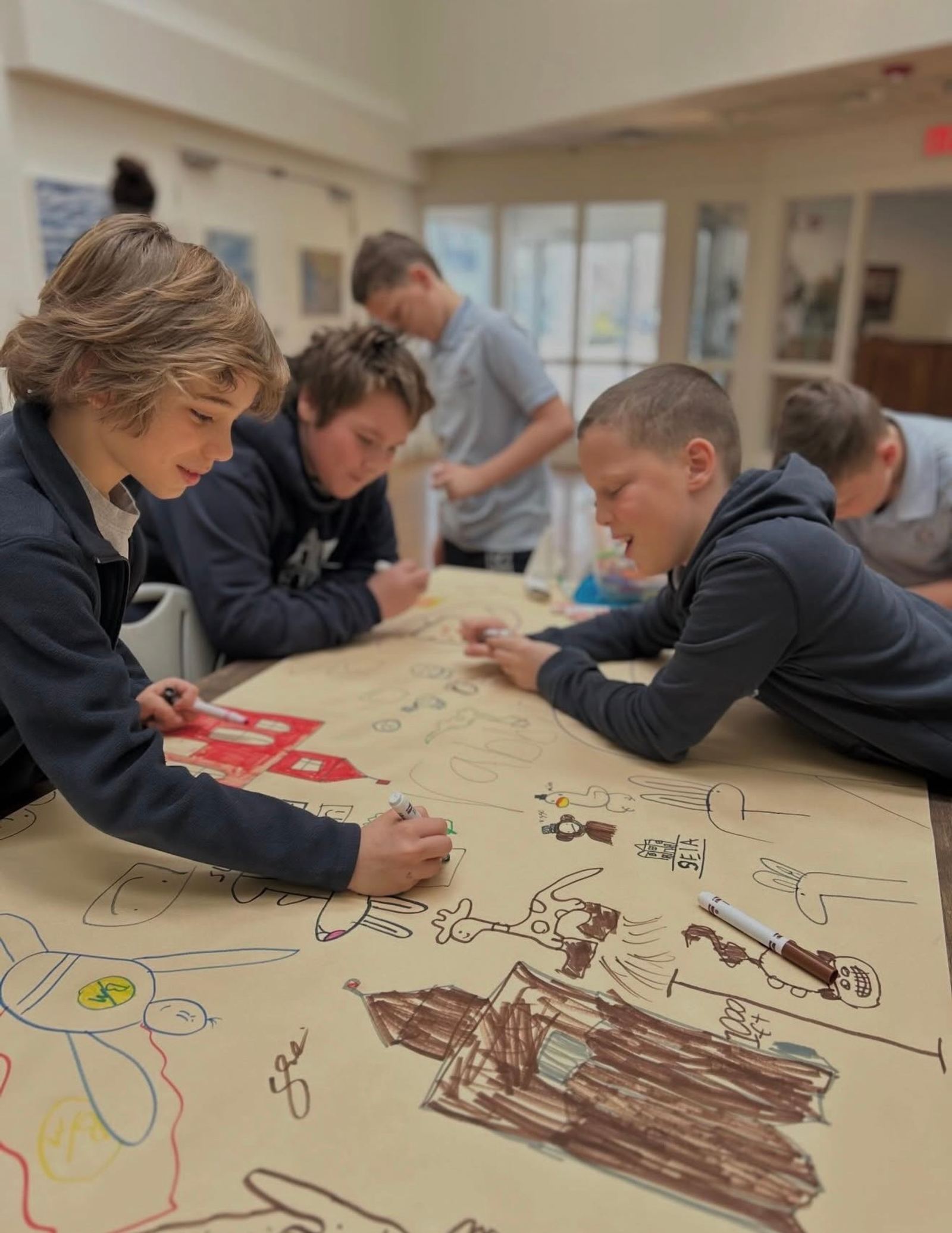 An elementary classroom moment as students work through their day across languages.