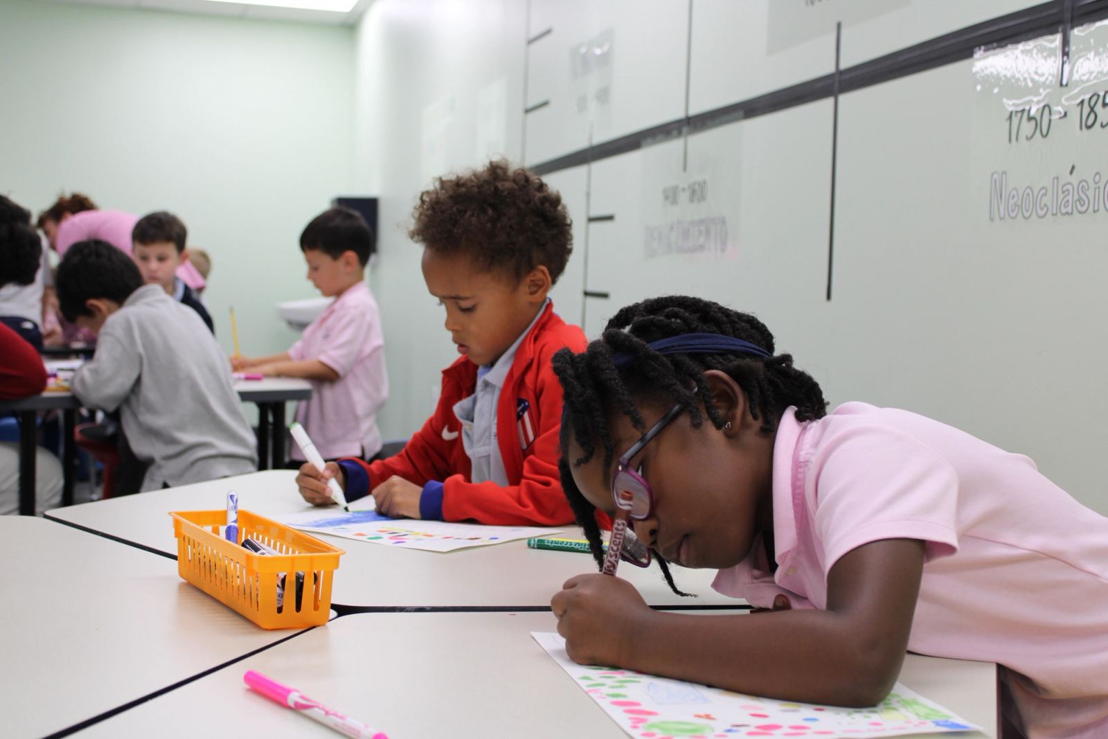 A SELA student painting during an art lesson