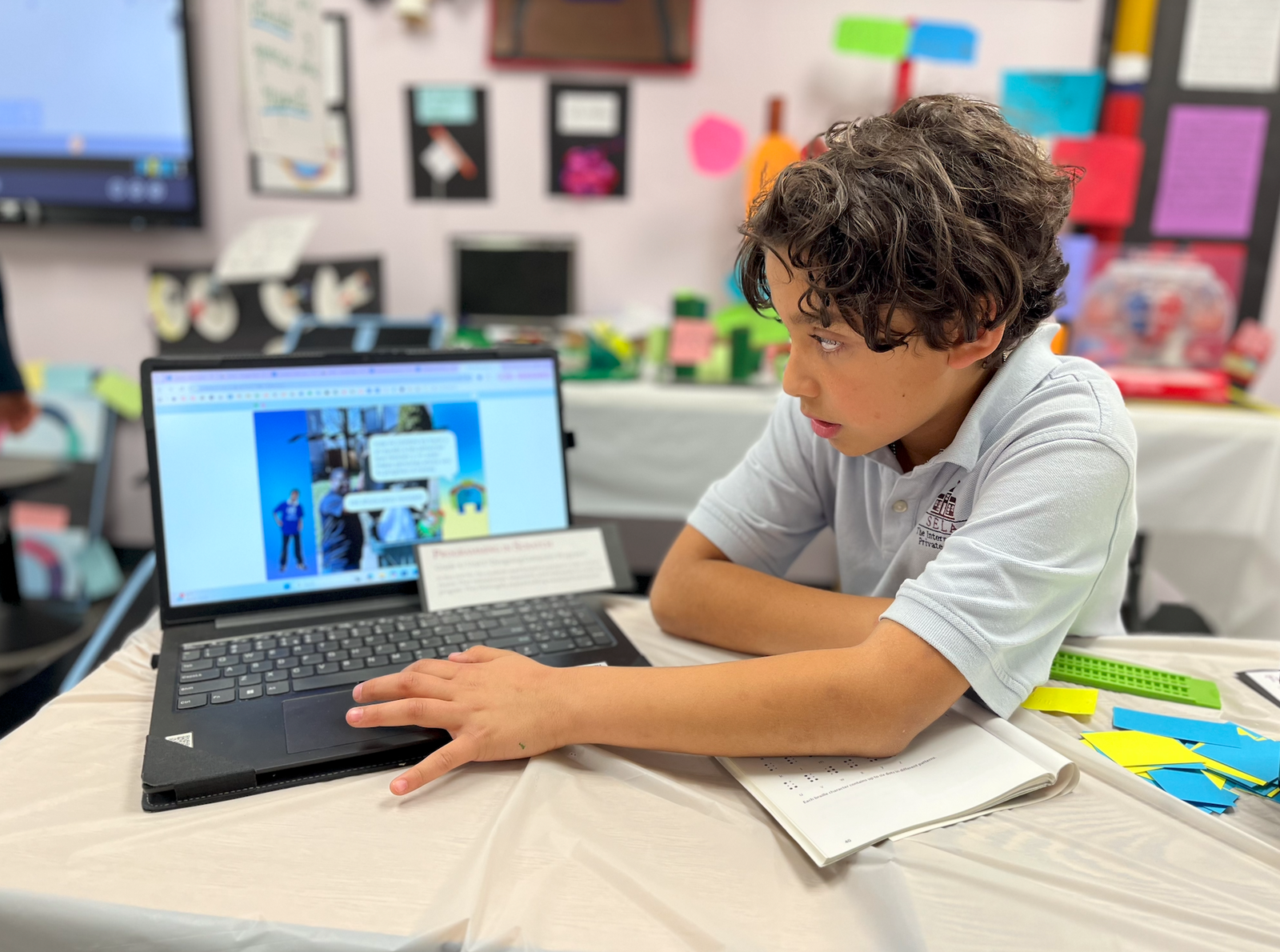 A SELA student using technology in the classroom