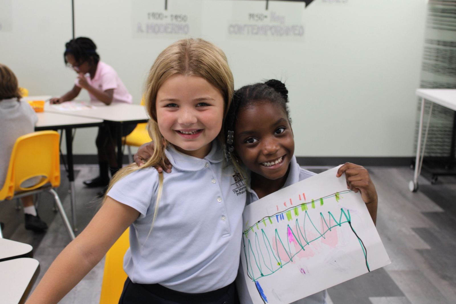 A SELA teacher leading children through a collaborative project