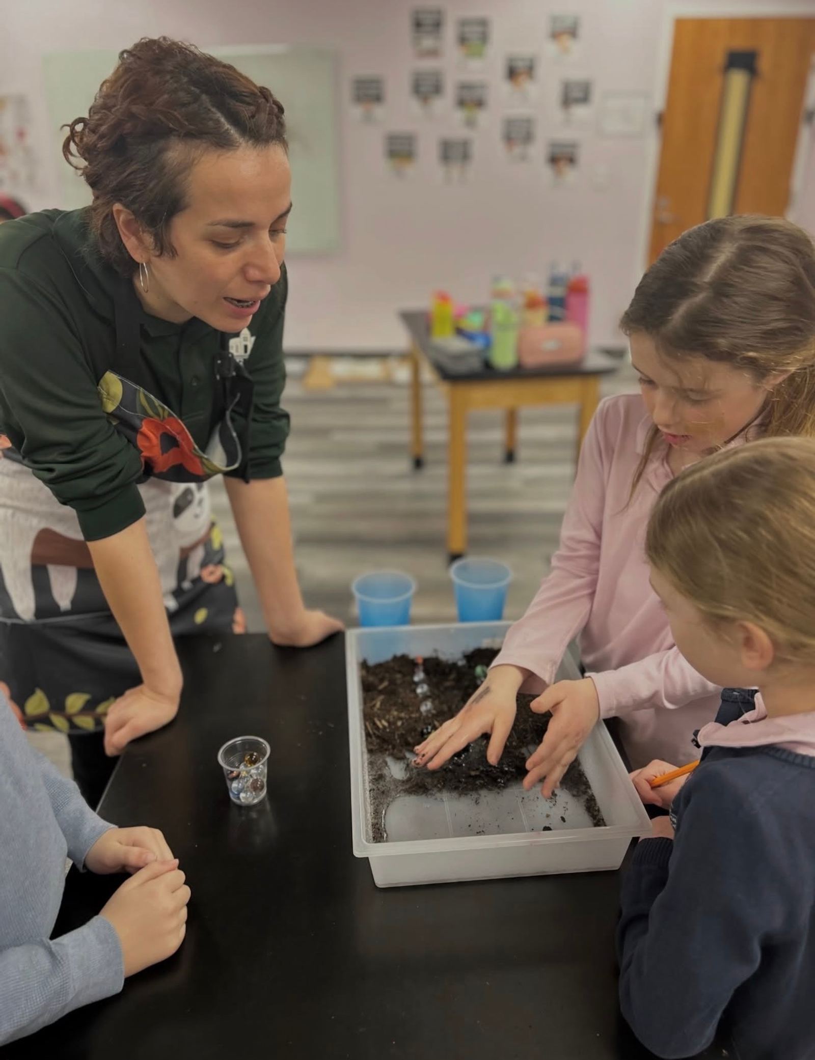 A SELA specialist guides students through a hands-on classroom activity.