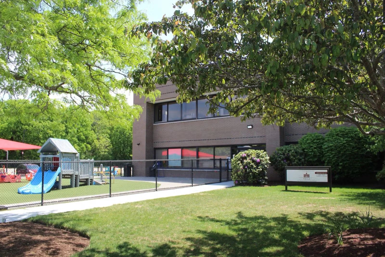Students' multi-sports court at SELA's Hingham campus on a bright day.