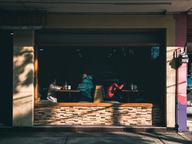 People dining inside a Mexico City restaurant, illustrating the global Pay What You Can Day initiative in 2026.