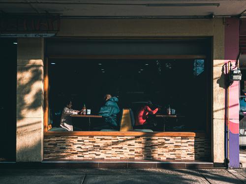 People dining inside a Mexico City restaurant, illustrating the global Pay What You Can Day initiative in 2026.